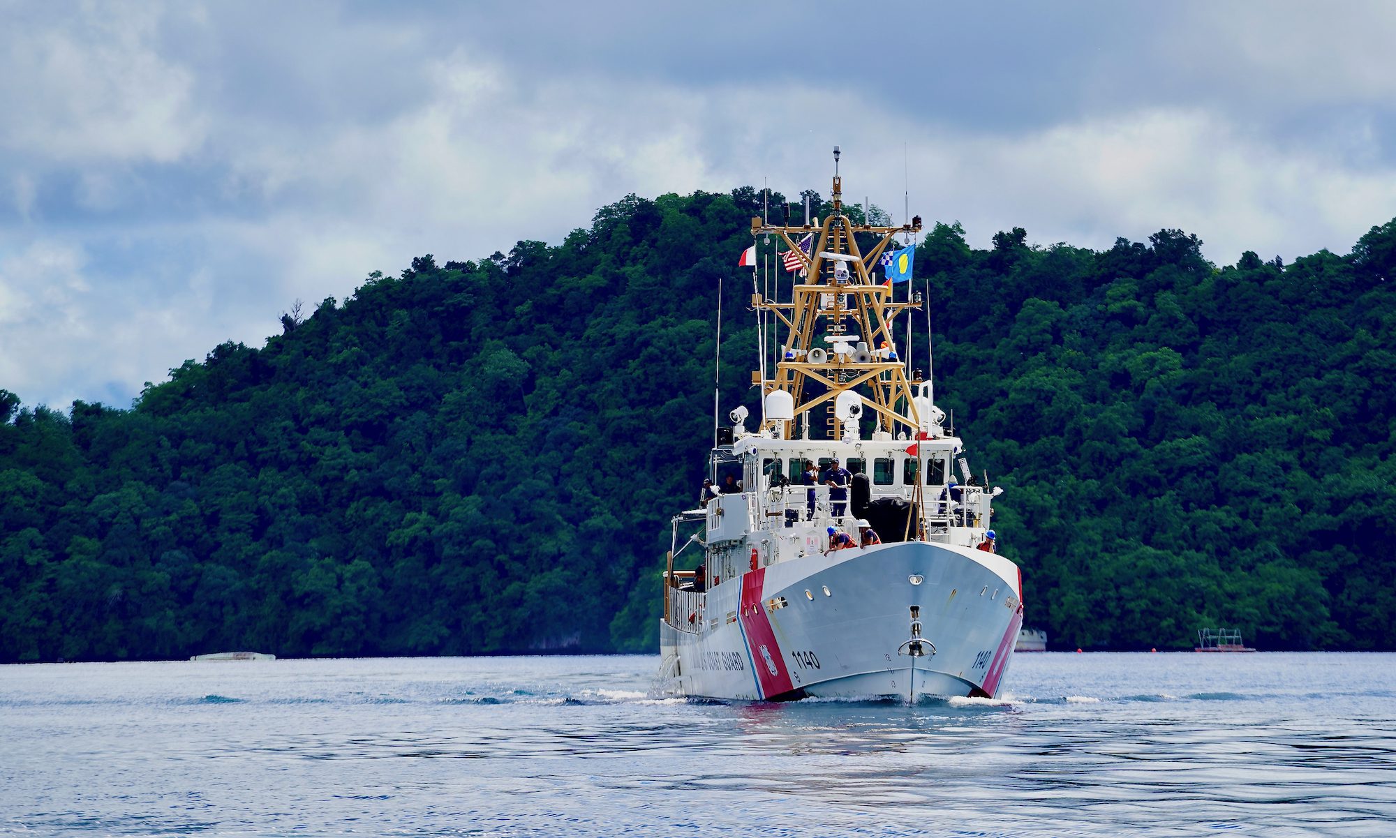 The crew of USCGC Oliver Henry (WPC 1140) departs Palau on an expeditionary patrol, March 28, 2023. U.S. Coast Guard Photo