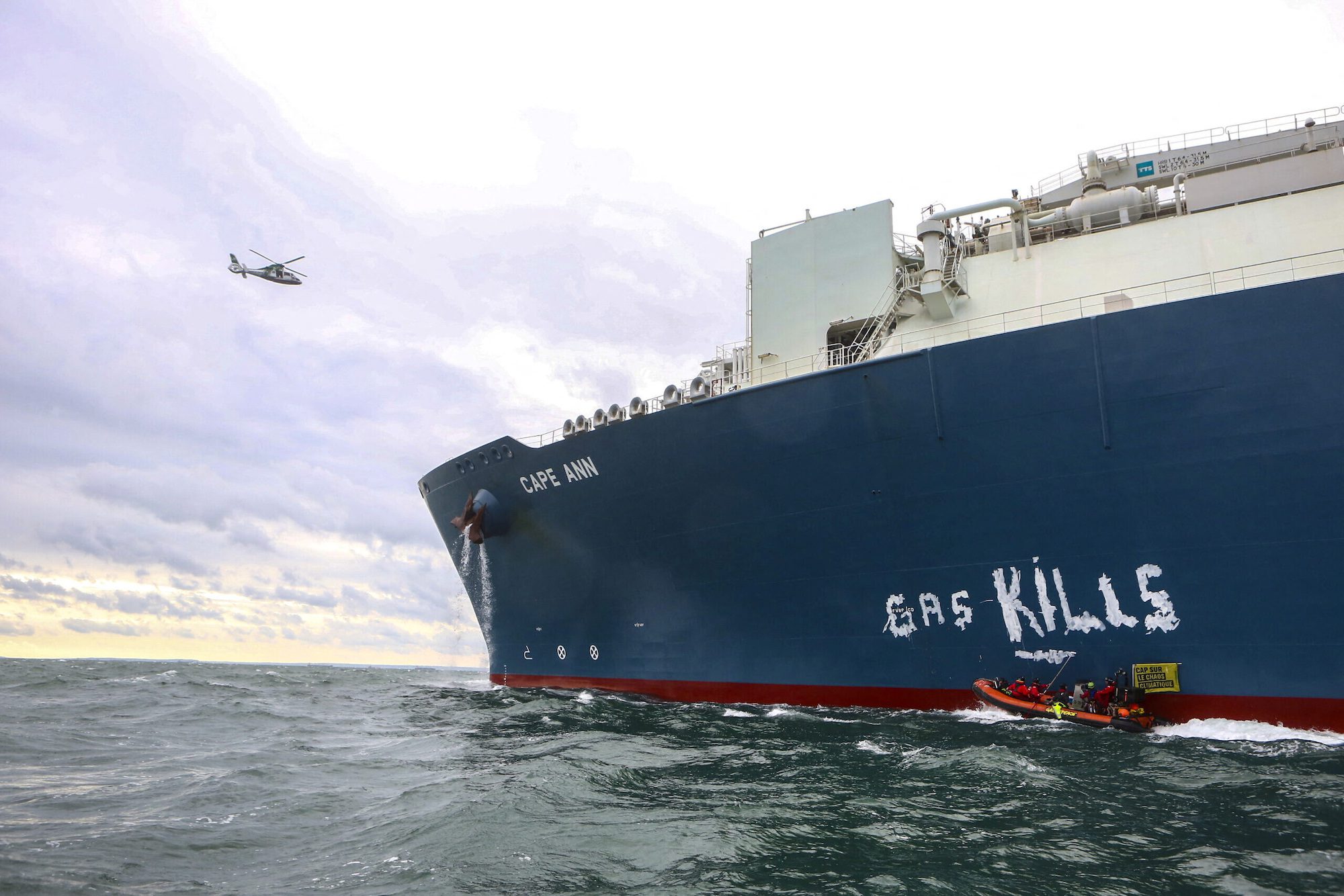 Greenpeace environmental activists on kayaks write "gas kills" on a LNG processing terminal set to be operated by Total Energies in Le Havre port, France, September 18, 2023. Jean Nicholas Guillo / Greenpeace /Handout via REUTERS