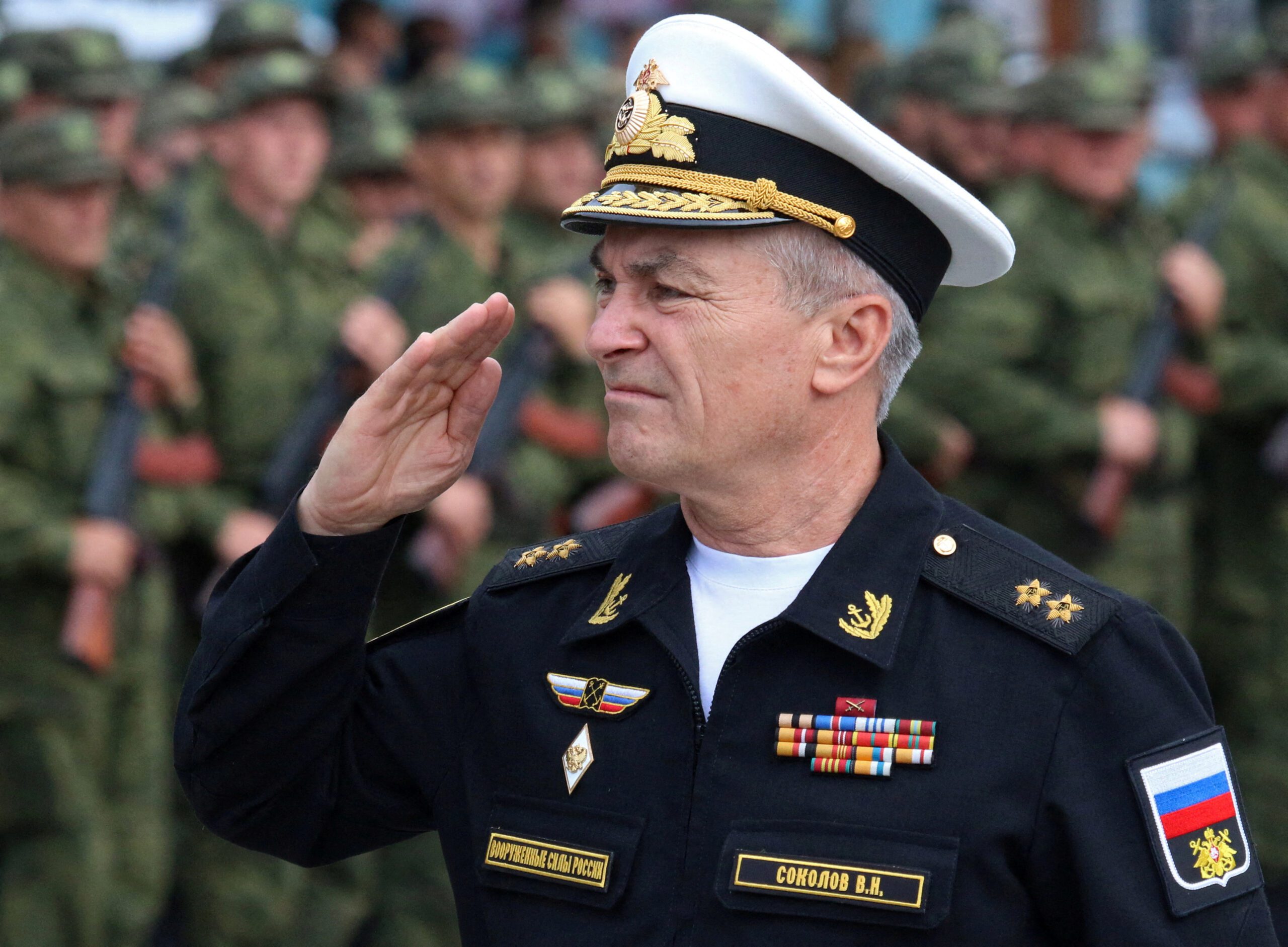 FILE PHOTO: Commander of the Russian Black Sea Fleet Vice-Admiral Viktor Sokolov salutes during a send-off ceremony for reservists drafted during partial mobilisation, in Sevastopol, Crimea September 27, 2022. REUTERS/Alexey Pavlishak/File Photo