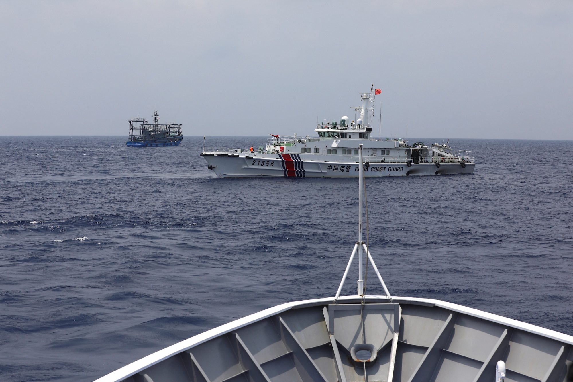 A Chinese Coast Guard ship is seen blocking the direction of a Philippine Coast Guard ship conducting a resupply mission for Filipino troops stationed at a grounded warship in the South China Sea, October 4, 2023. REUTERS/Adrian Portugal