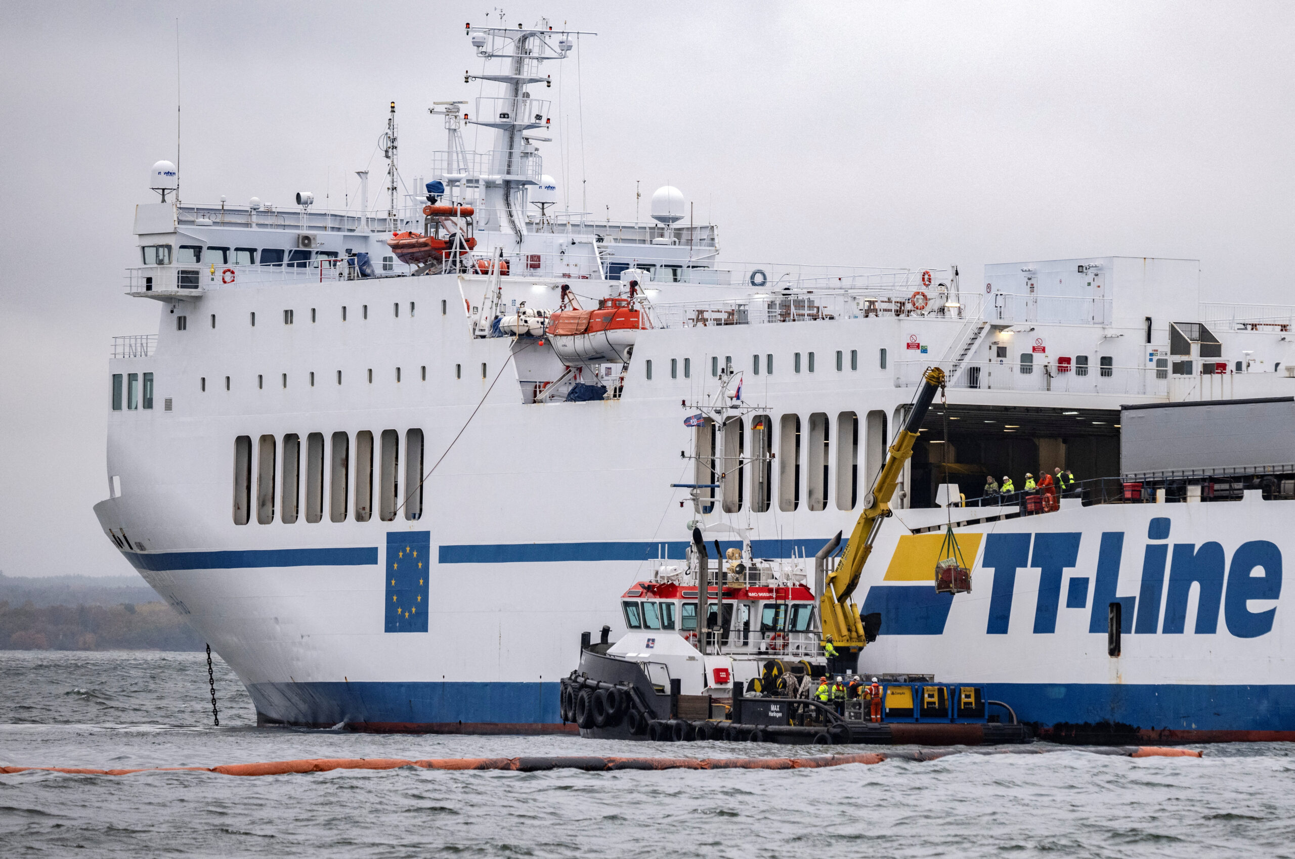 View of the grounded TT Line Marco Polo ferry and a tug boat, as the ferry leaks oil into the Baltic off the coast of Horvik, Sweden October 26, 2023. TT News Agency/Johan Nilsson via REUTERS