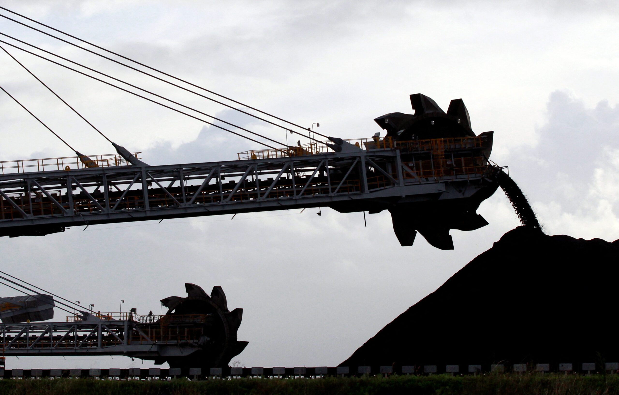 A stacker/reclaimer places coal in stockpiles at the port in Newcastle, Australia.REUTERS/File Photo