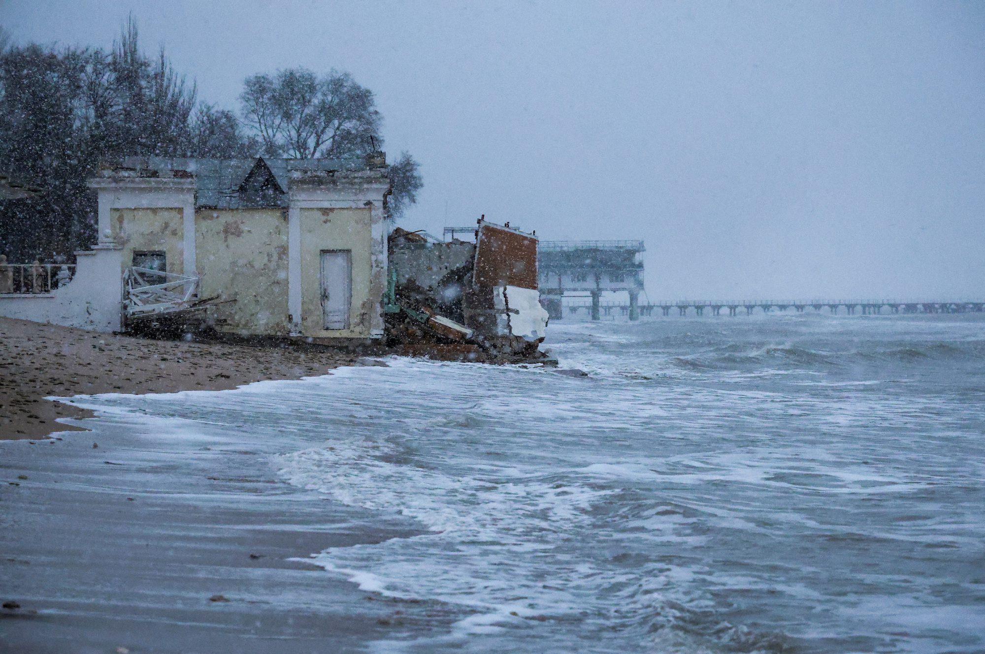 A view shows a damaged building on a beach affected by a powerful storm in Yevpatoriya, Crimea, November 27, 2023. REUTERS/Alexey Pavlishak