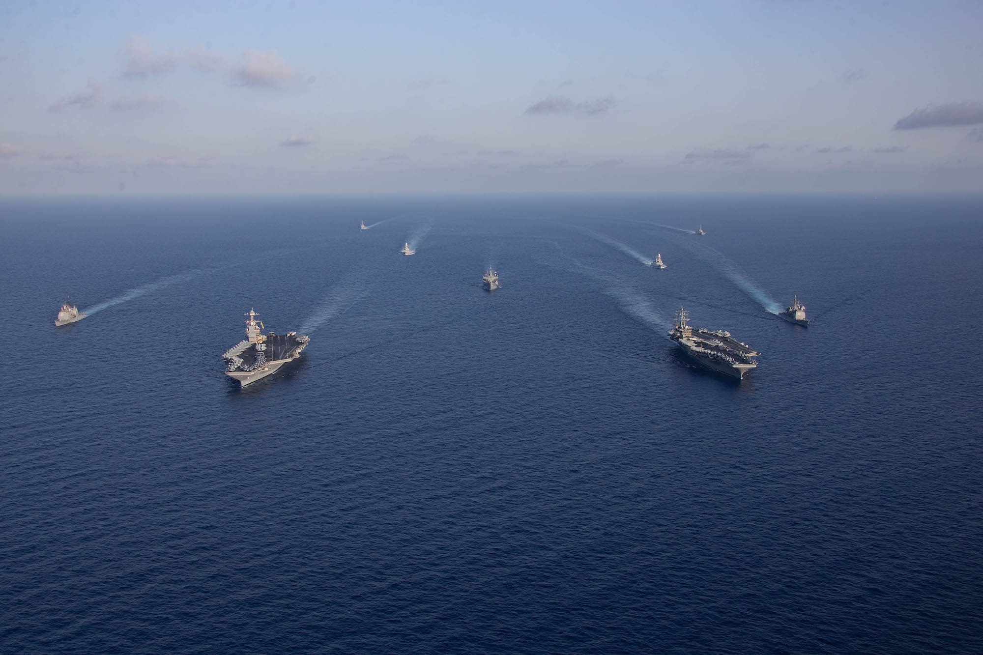 Ships from the Gerald R. Ford and Dwight D. Eisenhower Carrier Strike Groups (CSG) sail in formation in the Mediterranean Sea