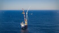 Photo shows the installation of the first offshore wind turbine at South Fork Wind