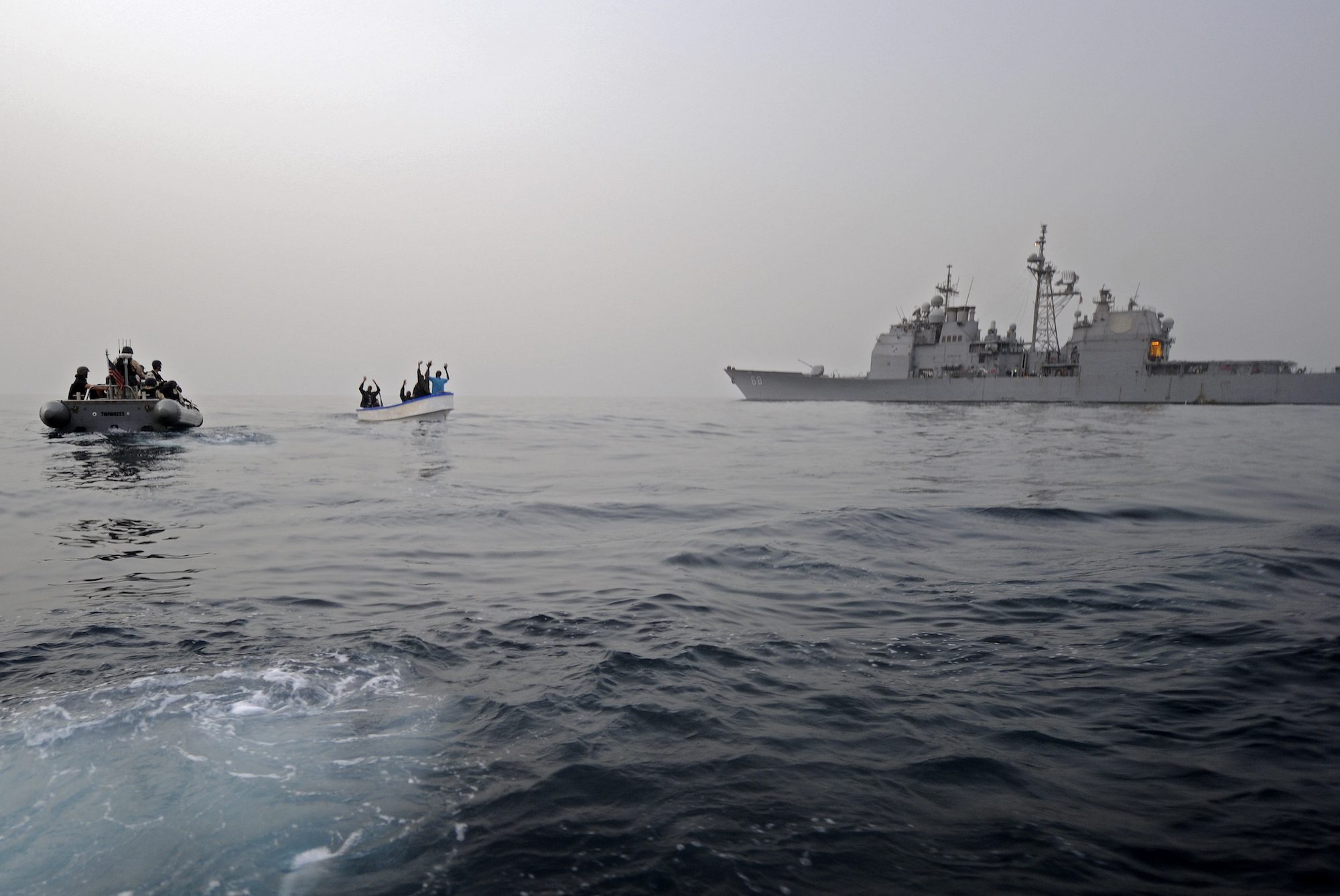 FILE PHOTO: A visit, board, search and seizure team assigned to the guided-missile cruiser USS Anzio investigates a suspected pirate skiff in the Gulf of Aden, July 22, 2011. U.S. Navy photo