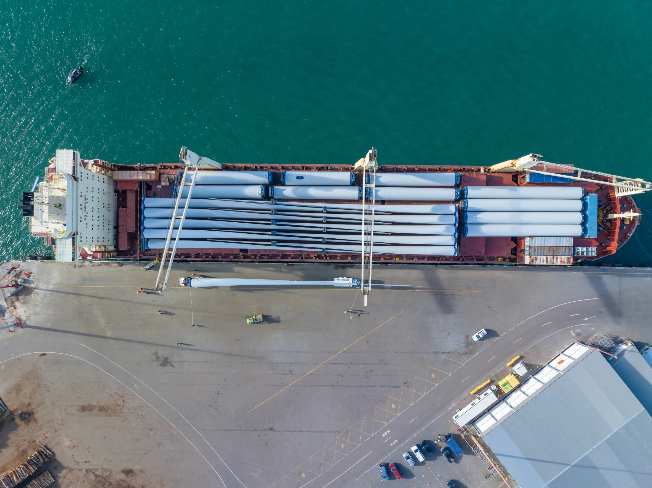 An aerial view of a Swire Project ship carrying wind turbine blades