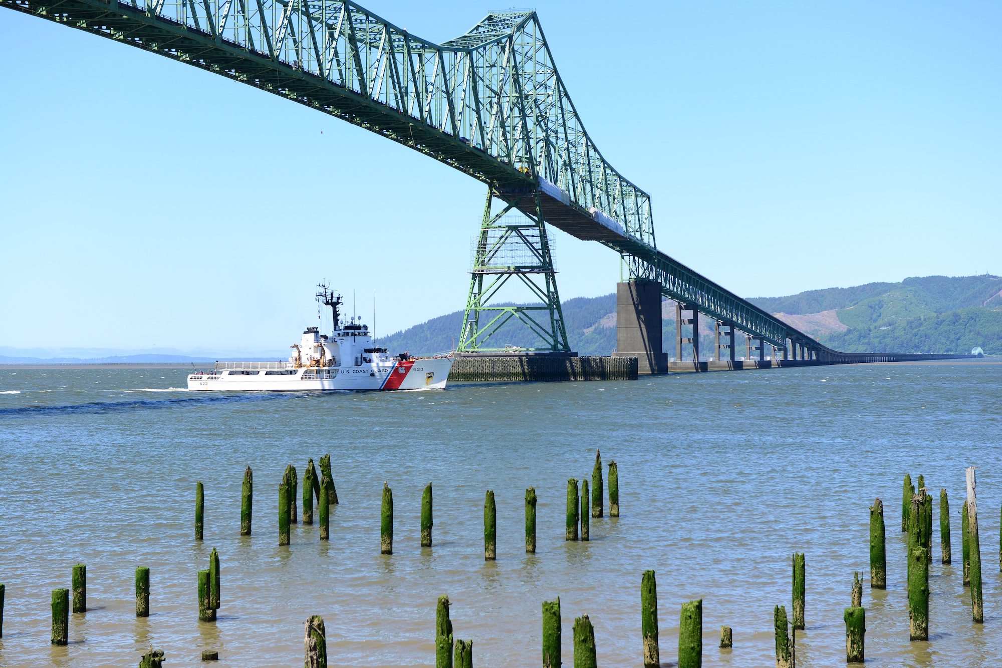 The Coast Guard Cutter Steadfast, a 210-foot Medium-Endurance Cutter, transits up the Columbia River and under the Astoria-Meglar Bridge as it returns to its homeport in Astoria, Ore., May 11, 2016. U.S. Coast Guard Photo