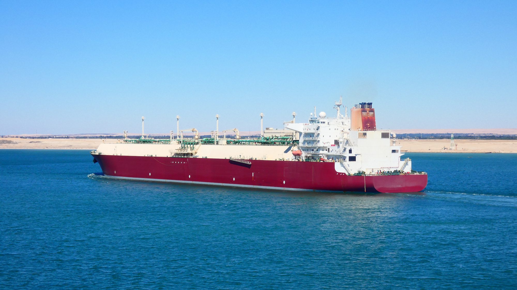A red LNG carrier in the Suez Canal