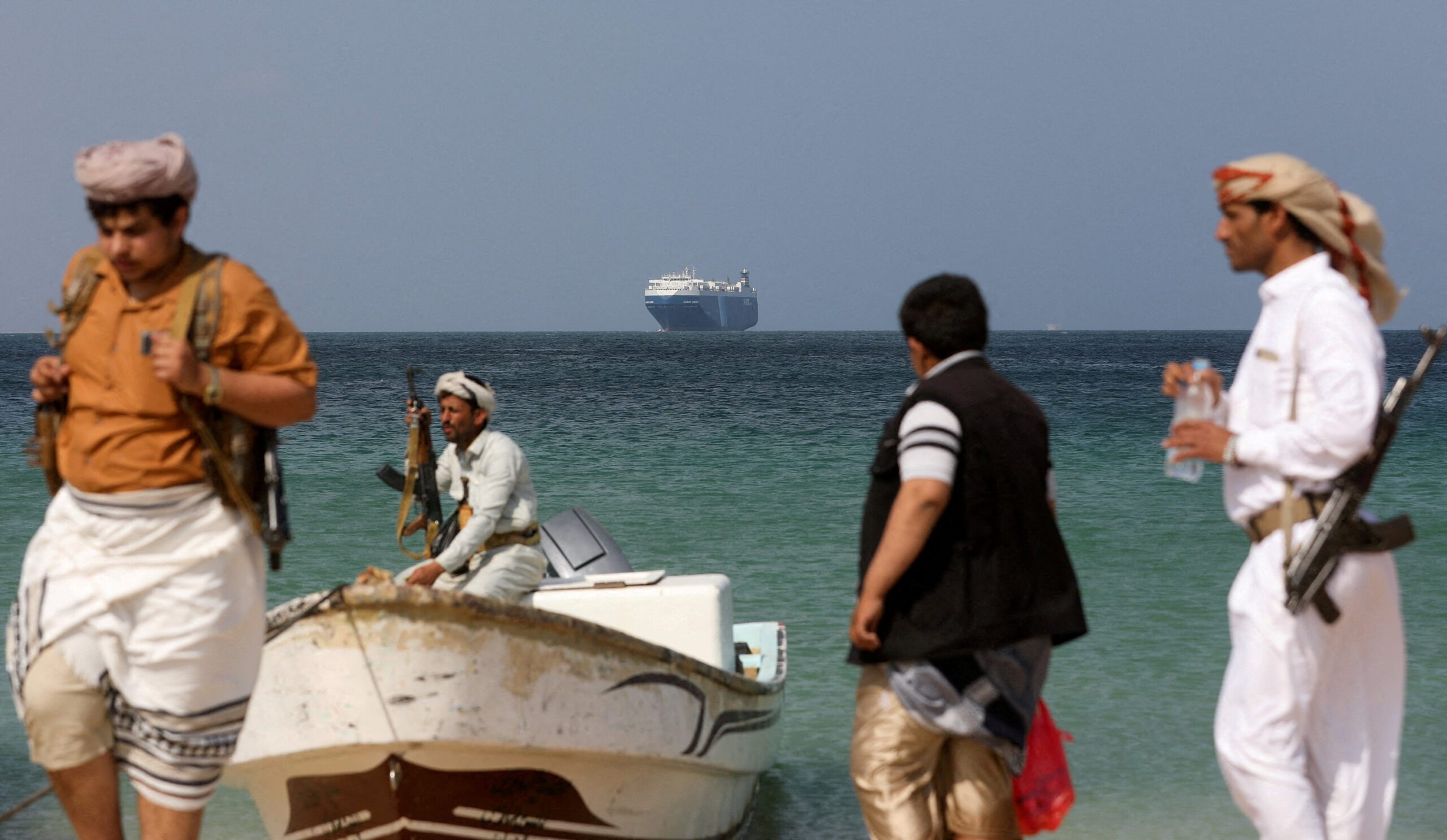 Houthi stand on beach after ship attack