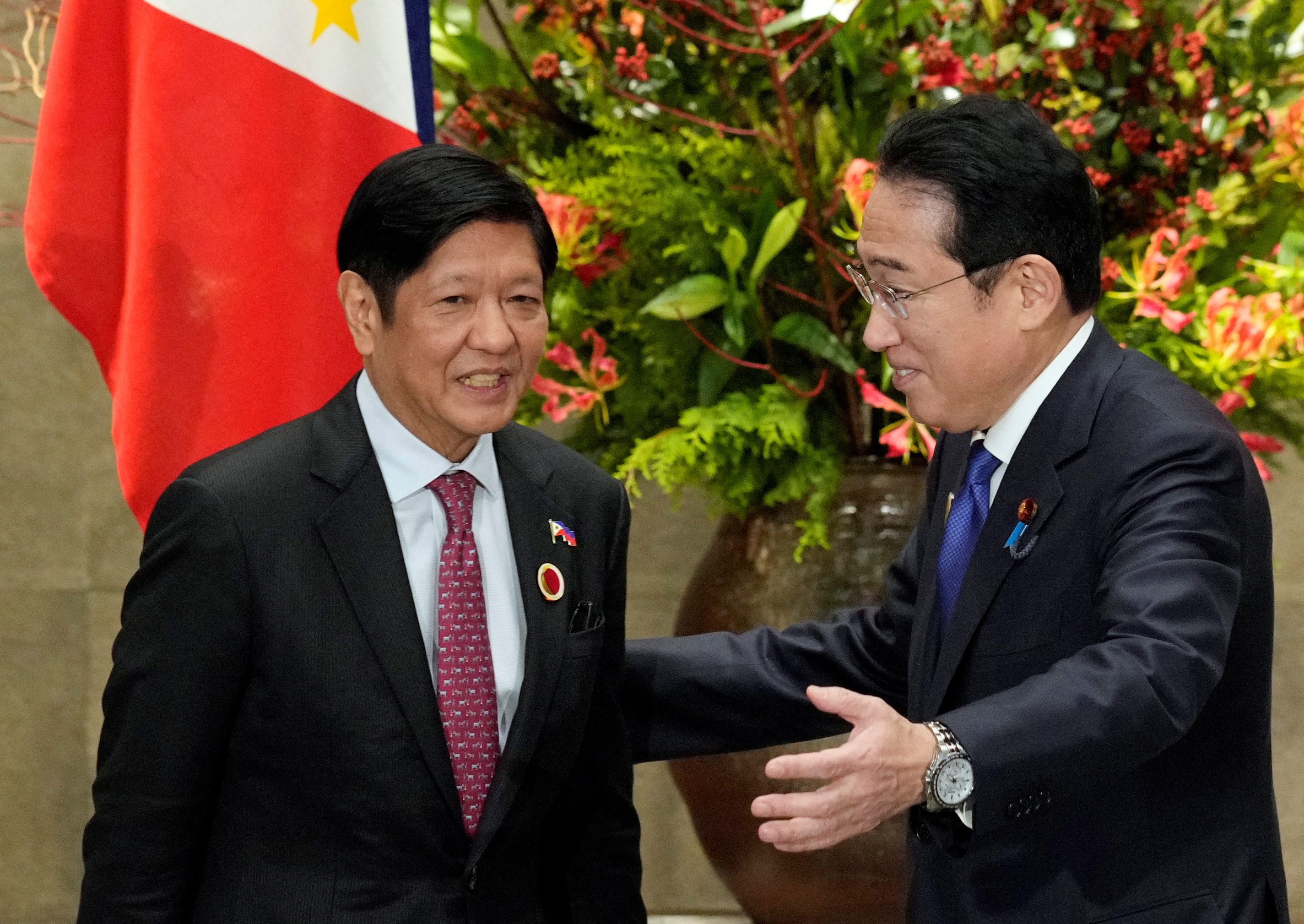 Japan's Prime Minister Fumio Kishida greets Philippines' President Ferdinand Marcos Jr.