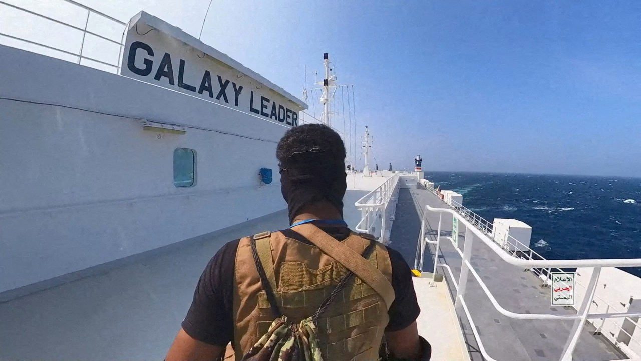 Houthi fighter stands on the Galaxy Leader cargo ship in the Red Sea. Houthi Military Media/Handout via REUTERS