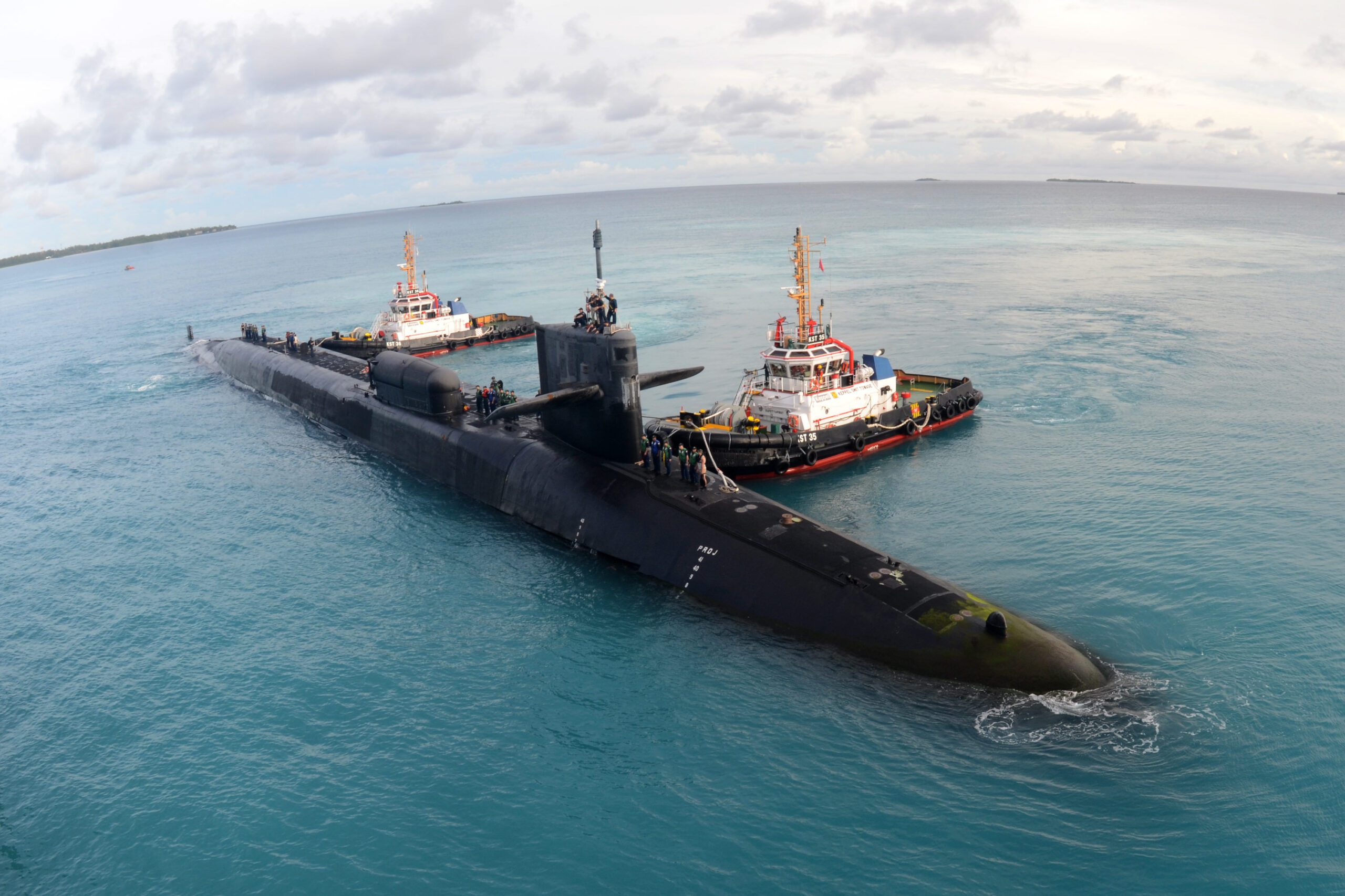 Ohio-class guided-missile submarine USS Georgia docking with the help of tugboats