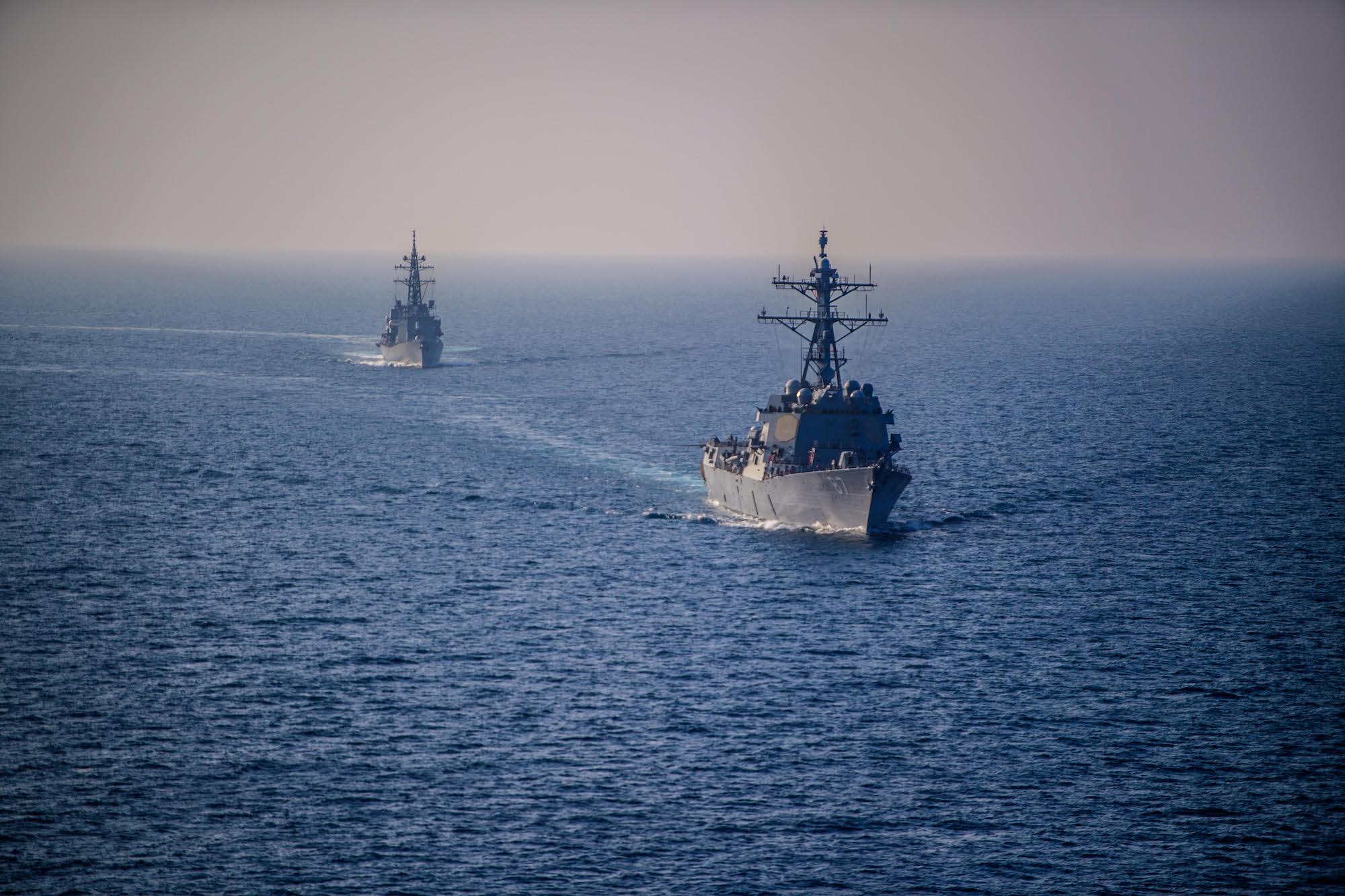The guided-missile destroyer USS Mason (DDG 87) sails alongside the Japanese Murasame-class destroyer Akebono (DD 108) in the Gulf of Aden Nov. 25, 2023. U.S. Navy Photo