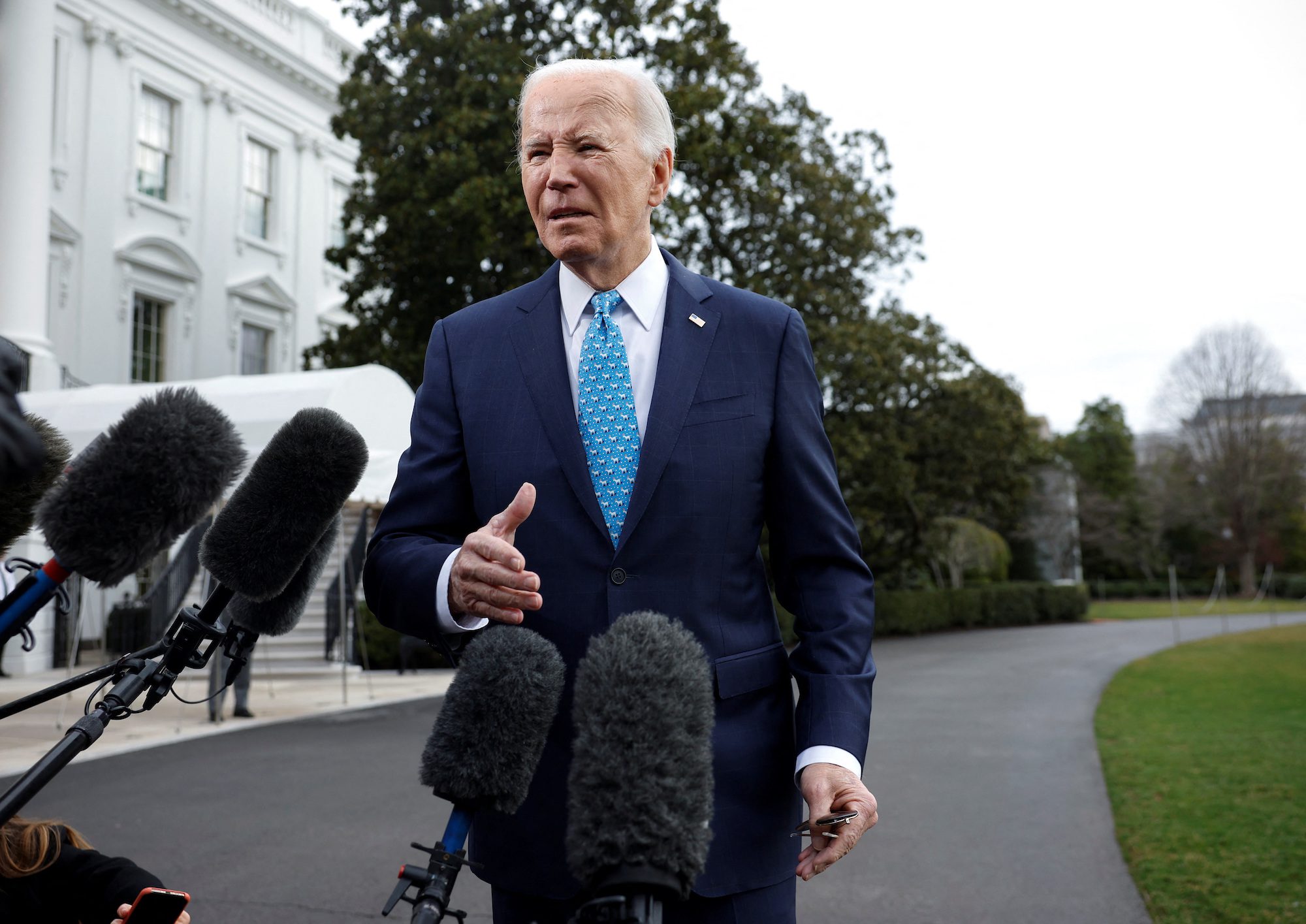 U.S. President Joe Biden speaks to the media before he departs the White House for Florida, in Washington, U.S., January 30, 2024. REUTERS/Evelyn Hockstein