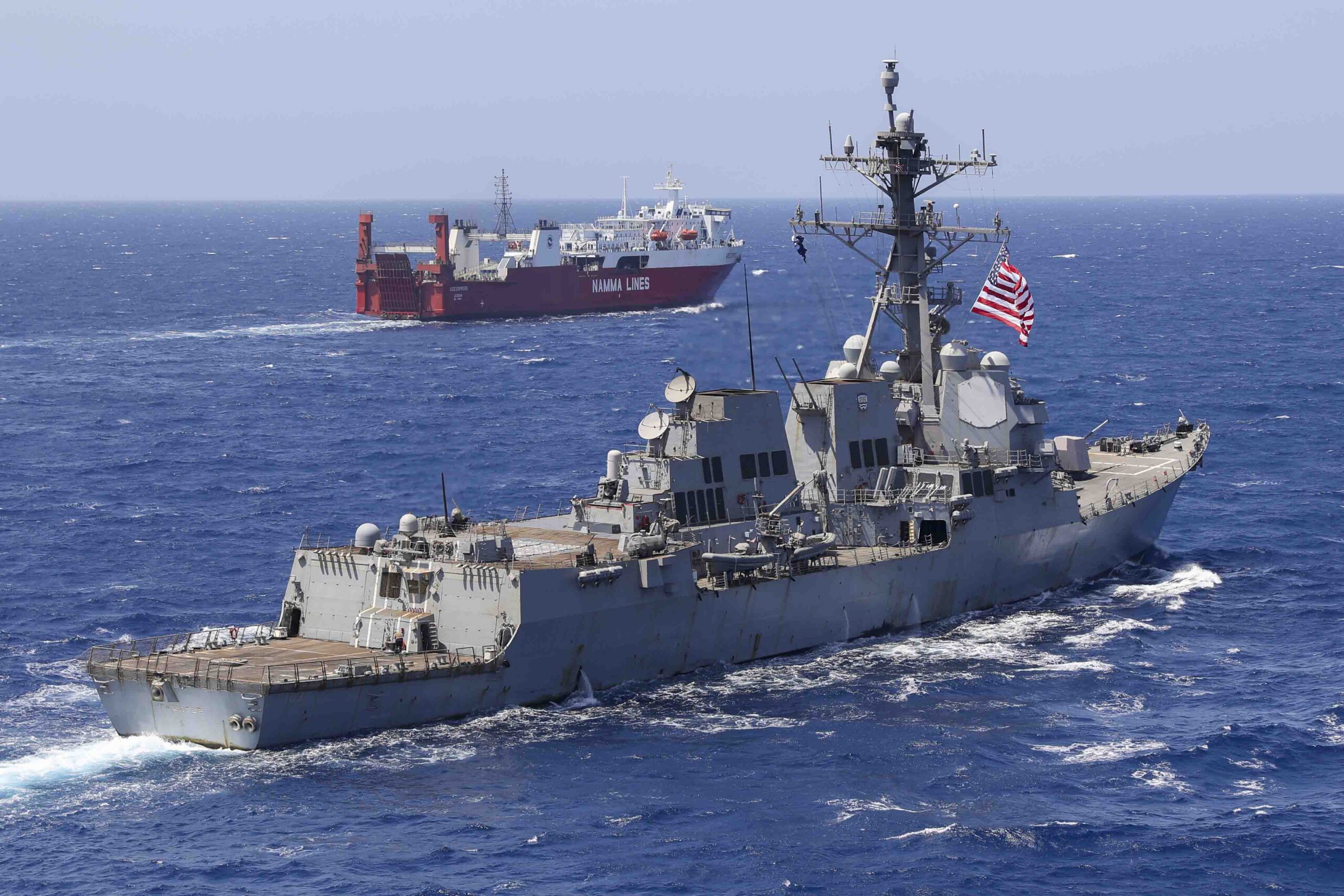 US Navy destroyer USS Truxtun escorts merchant ship in red sea