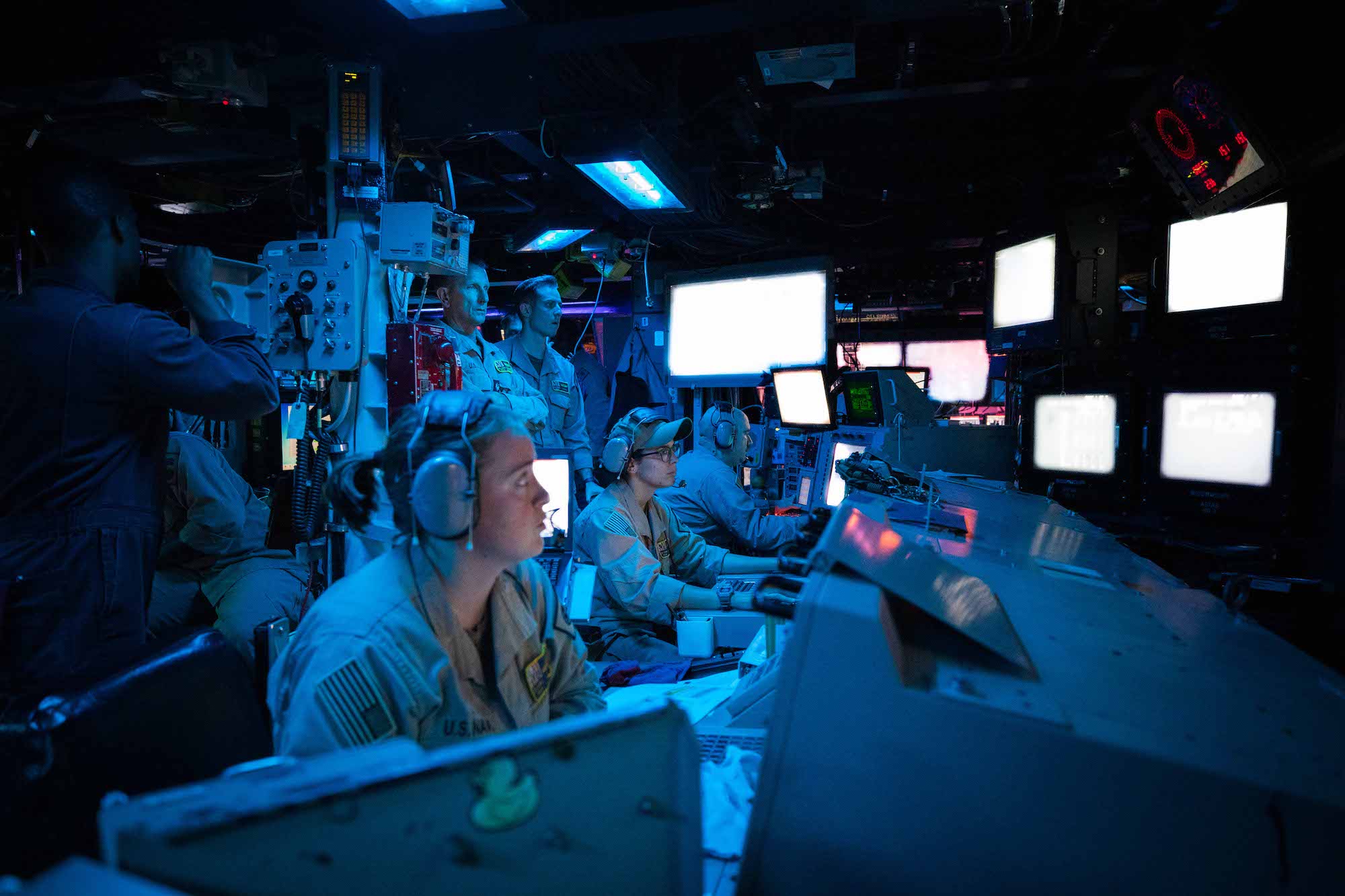 Sailors assigned to the Arleigh Burke-class guided-missile destroyer USS Carney (DDG 64) stand watch in the ship’s Combat Information Center during an operation to defeat a combination of Houthi missiles and unmanned aerial vehicles, Oct. 19. U.S. Navy Photo
