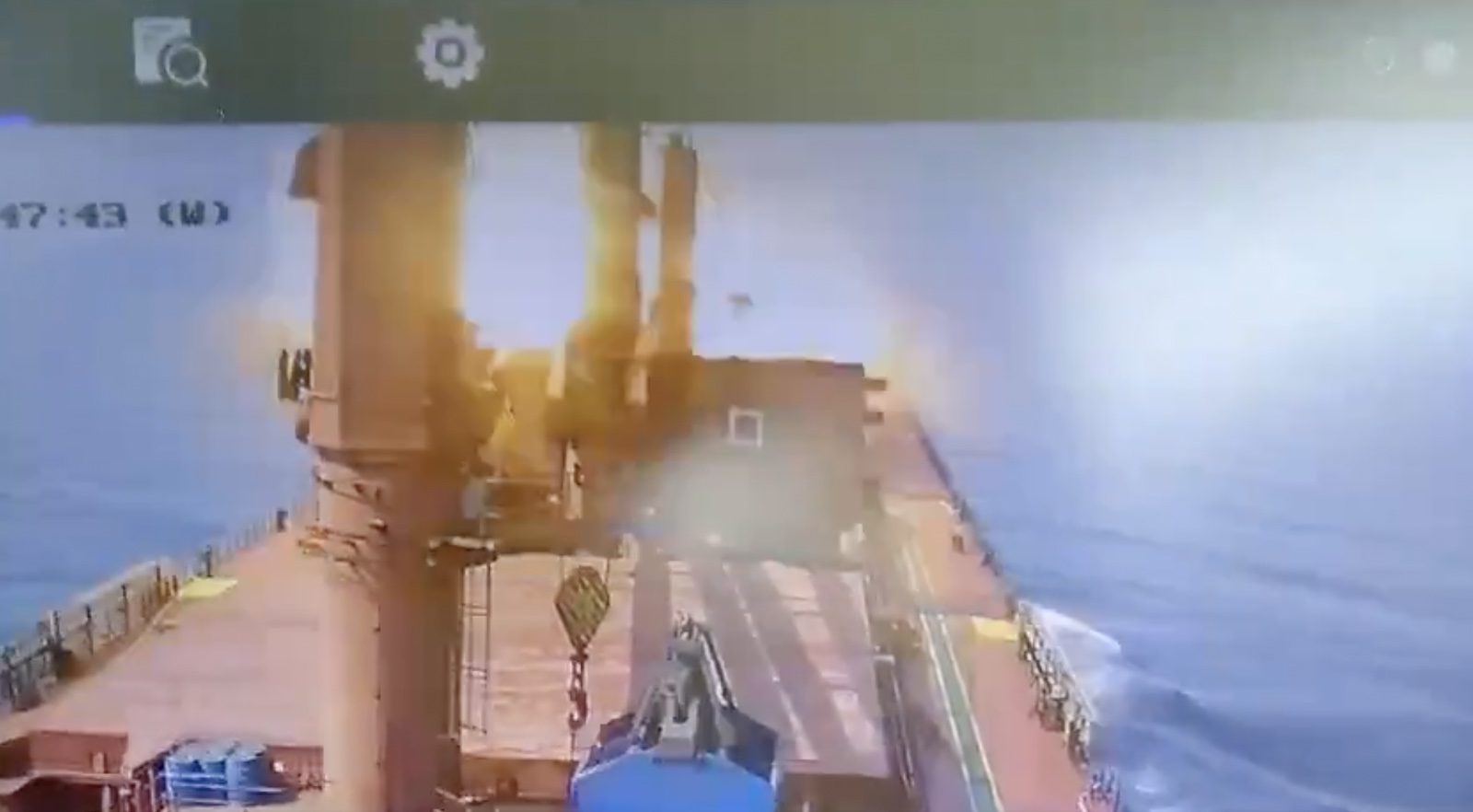 A screenshot from video allegedly shows the moment an anti-ship ballistic missile hits the deck of the M/V Zografia in the Southern Red Sea.
