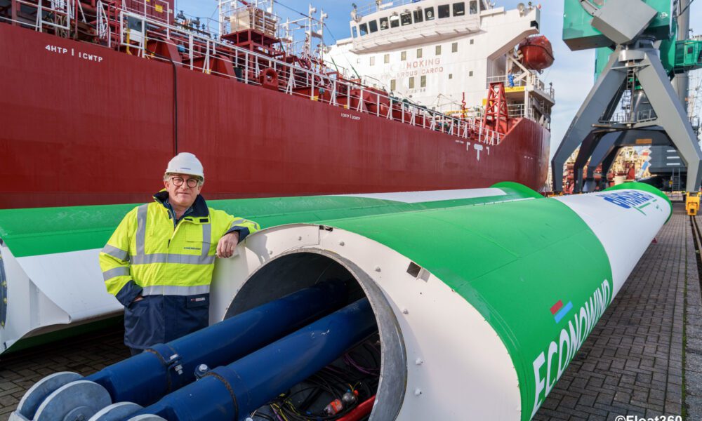 Chemship CEO Niels Grotz standing next two VentoFoils next to the MT Chemical Challenger. Photo courtesy Chemship