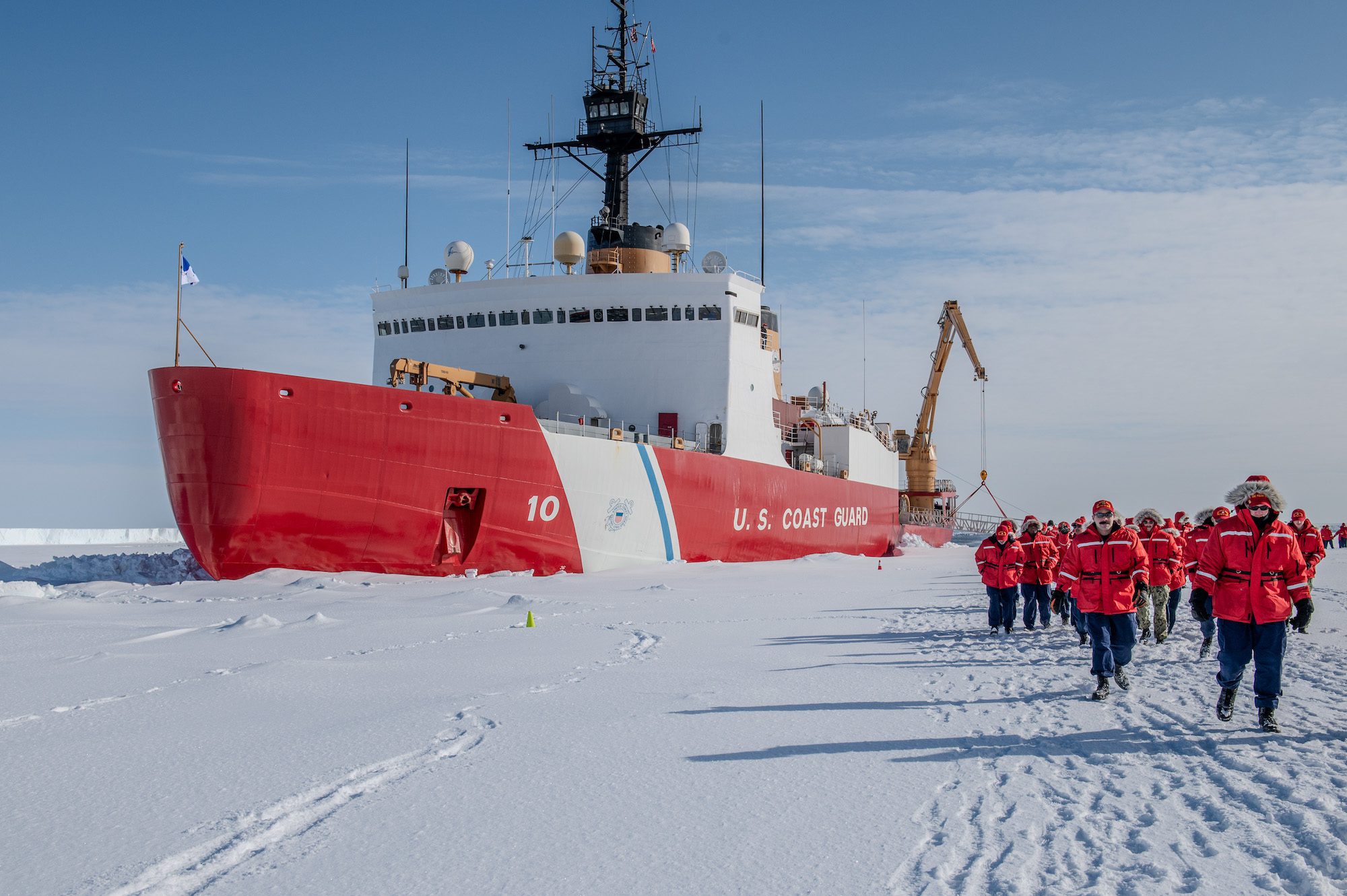 The crew of the U.S. Coast Guard Cutter Polar Star (WAGB 10) walks toward the Ross Ice Shelf, Antarctica, Feb. 3, 2024. U.S. Coast Guard Photo