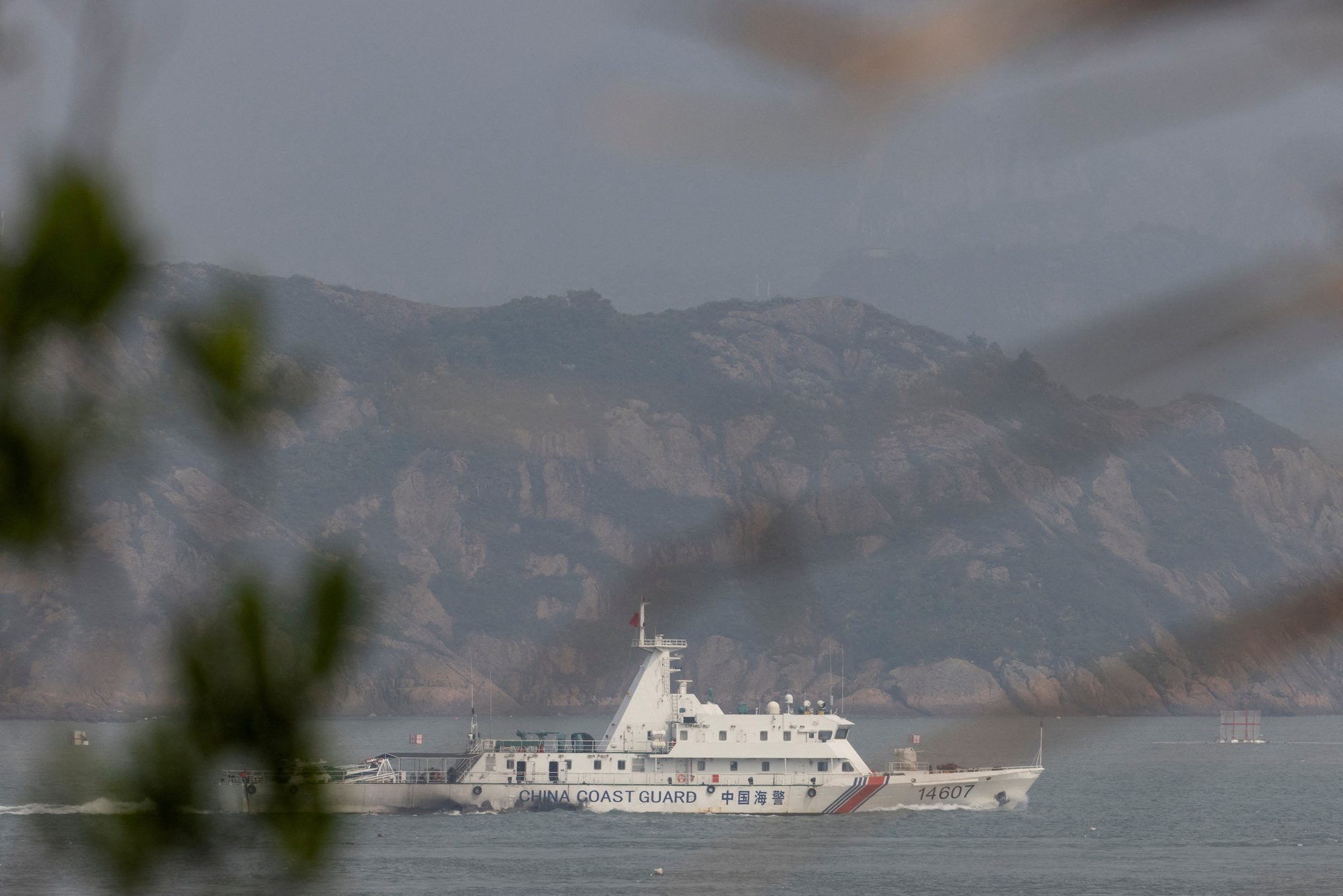 FILE PHOTO: A Chinese coastguard ship sails during a military drill near Fuzhou, Fujian Province, near the Taiwan-controlled Matsu Islands that are close to the Chinese coast, China, April 8, 2023. REUTERS/Thomas Peter/File Photo/File Photo