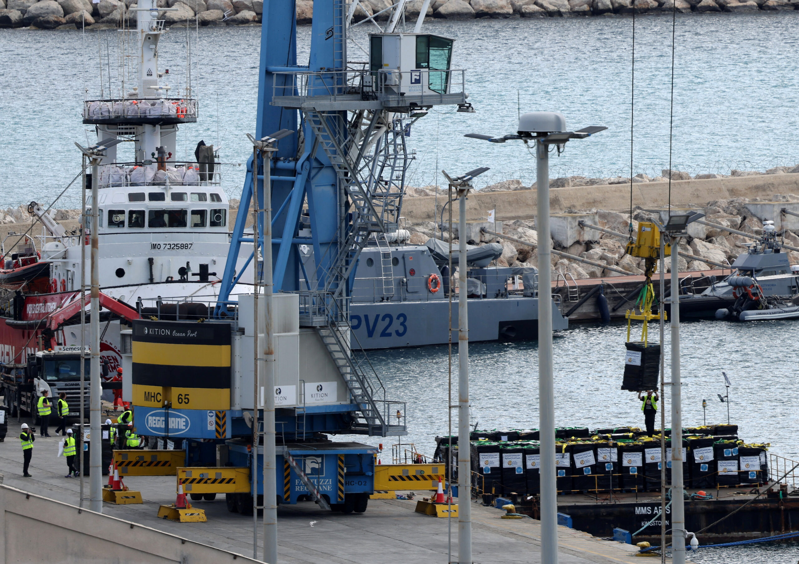 Humanitarian aid for Gaza is loaded onto platform in Larnaca. REUTERS/Yiannis Kourtoglou