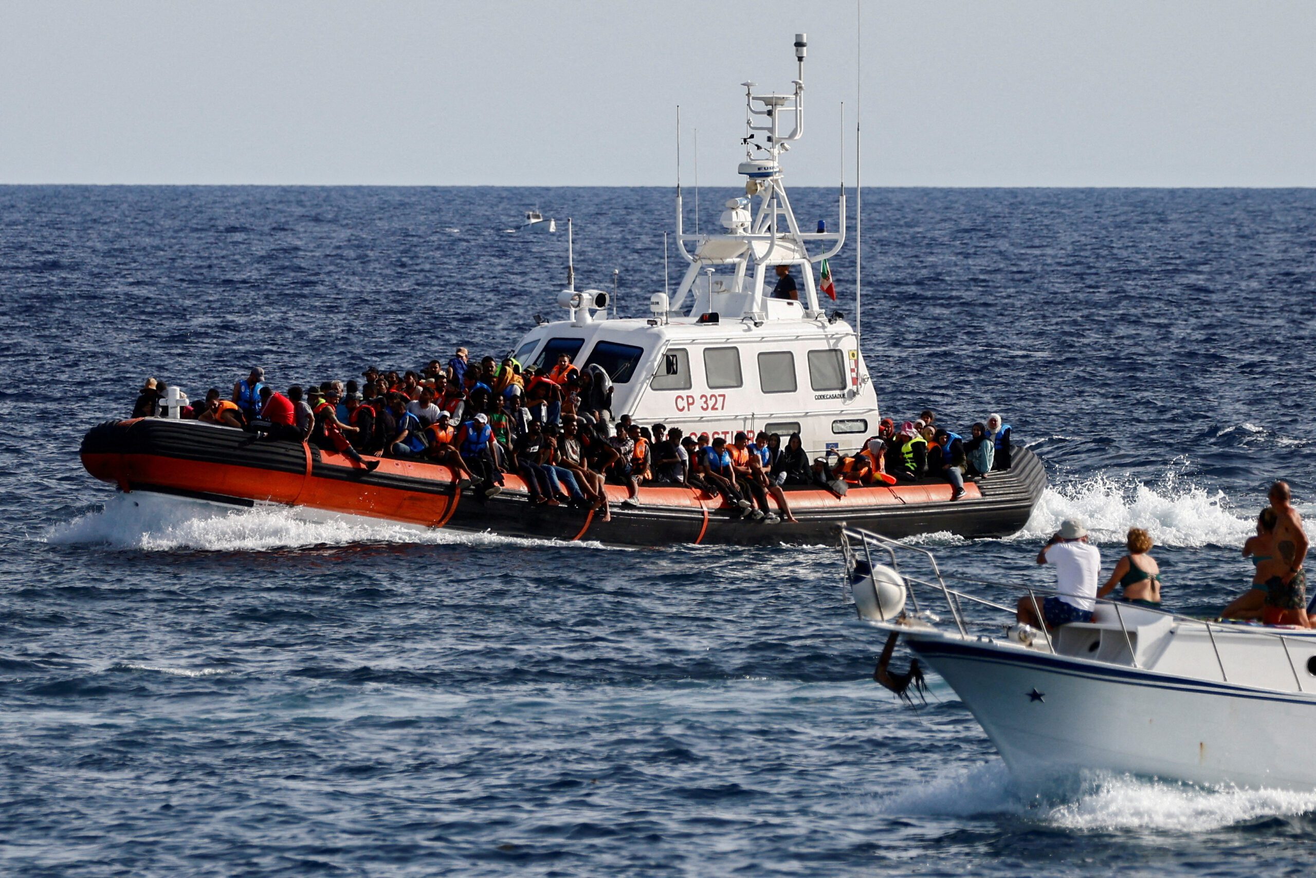 Migrants in Lampedusa. REUTERS/Yara Nardi//File Photo