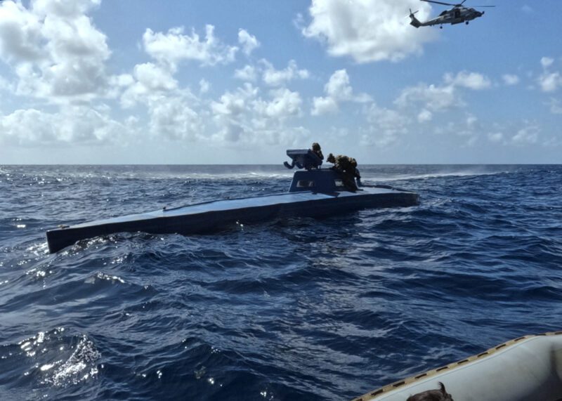 The Ticonderoga-class guided missile cruiser USS Leyte Gulf (CG 55), embarked U.S. Coast Guard Law Enforcement Detachment (LEDET) and Helicopter Maritime Strike Squadron (HSM) 50 work together to intercept a self-propelled semi-submersible drug smuggling vessel (SPSS), in the Atlantic Ocean, March 22, 2024. U.S. Coast Guard Photo