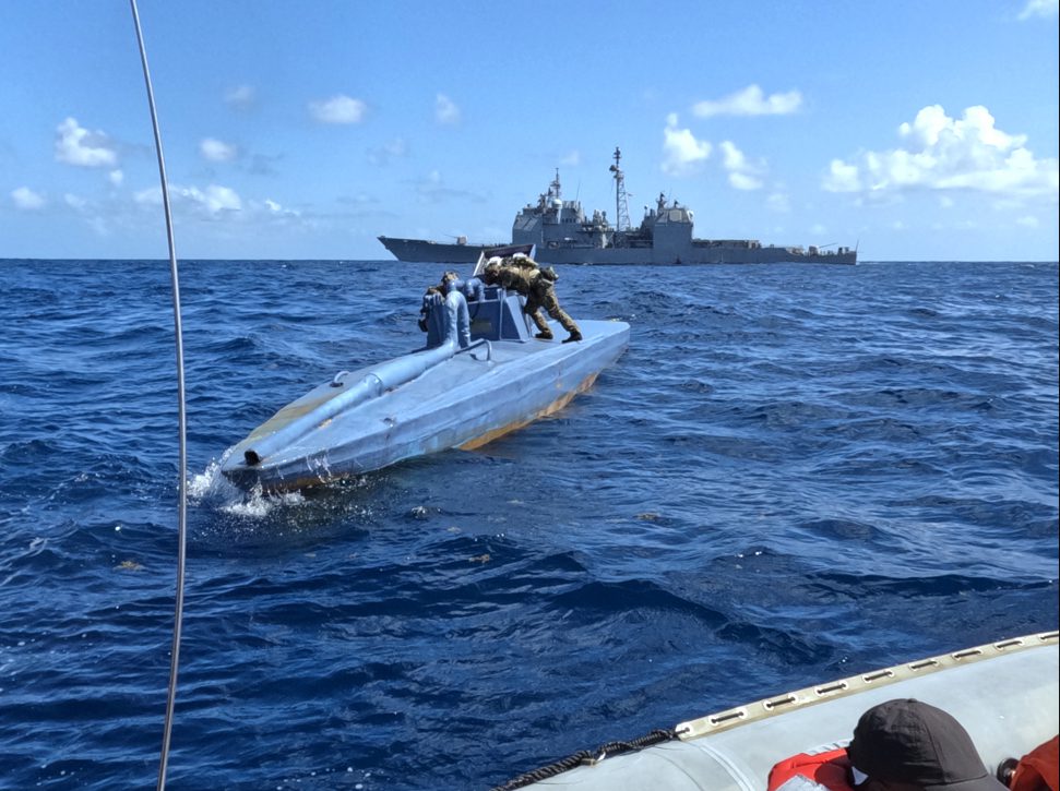 The Ticonderoga-class guided missile cruiser USS Leyte Gulf (CG 55), embarked U.S. Coast Guard Law Enforcement Detachment (LEDET) and Helicopter Maritime Strike Squadron (HSM) 50 work together to intercept a self-propelled semi-submersible drug smuggling vessel (SPSS), in the Atlantic Ocean, March 22, 2024. U.S. Coast Guard Photo