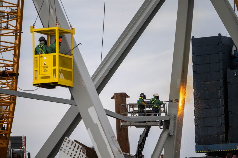 Demolition crews with the Unified Command begin cutting the top portion of the north side of the collapsed bridge into smaller sections for safe removal by crane in the Patapsco River, in Baltimore, Maryland, March 30, 2024. U.S. Coasts Guard Photo