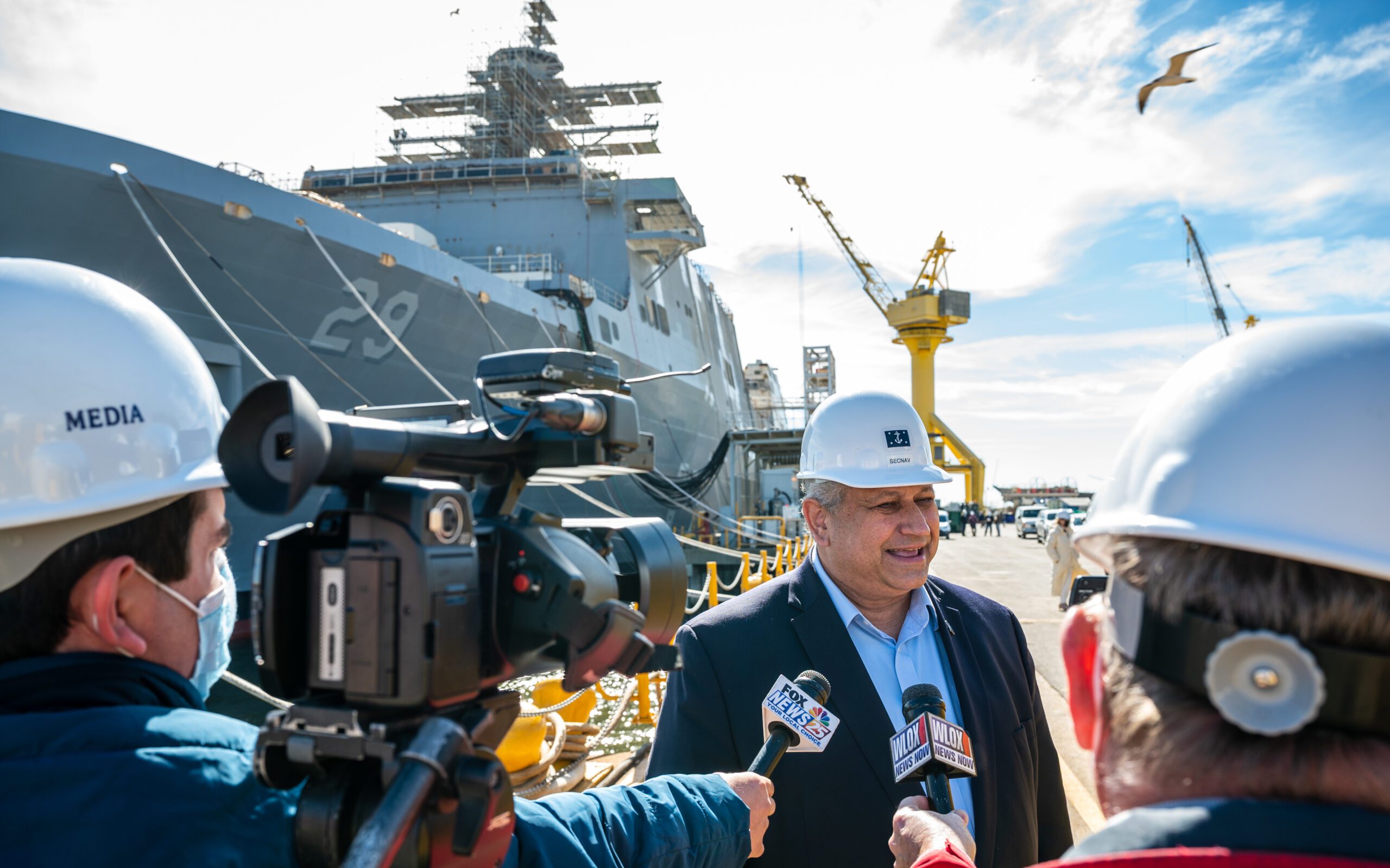 PASCAGOULA, Miss. (Jan 26, 2022) — Secretary of the Navy Carlos Del Toro participates in a media interview during a shipyard tour at Ingalls Shipbuilding in Pascagoula, Miss., Jan. 26, 2022. U.S. Navy Photo