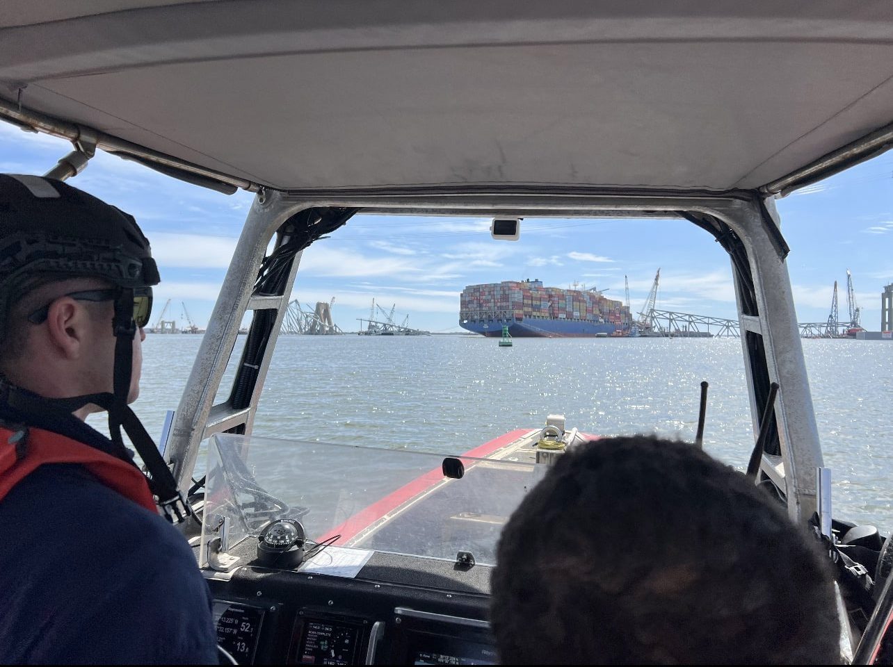 U.S. Coast Guard Cutter Diligence's (WMEC 616) small boat crew approaches the wreckage of the Francis Scott Key Bridge and motor vessel Dali in the aftermath of the bridge's collapse, March 26, 2024, in Baltimore, Maryland. U.S. Coast Guard Photo