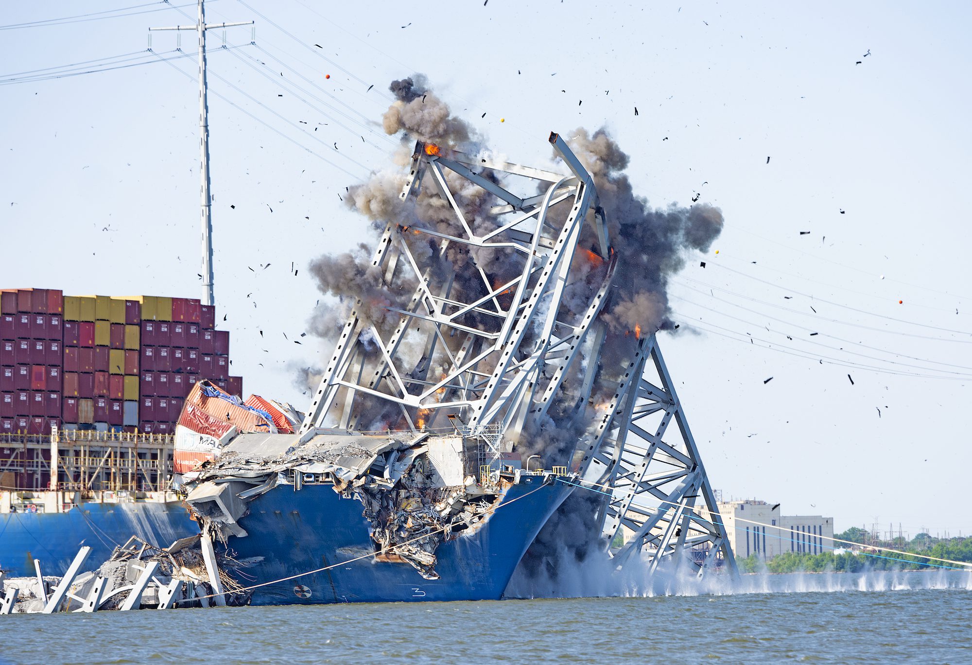Salvors with the Unified Command perform a controlled demolition, precision cutting of section 4 of the Francis Scott Key Bridge that sits on the port side of the bow of the M/V DALI, May 13, 2024. USACE Photo