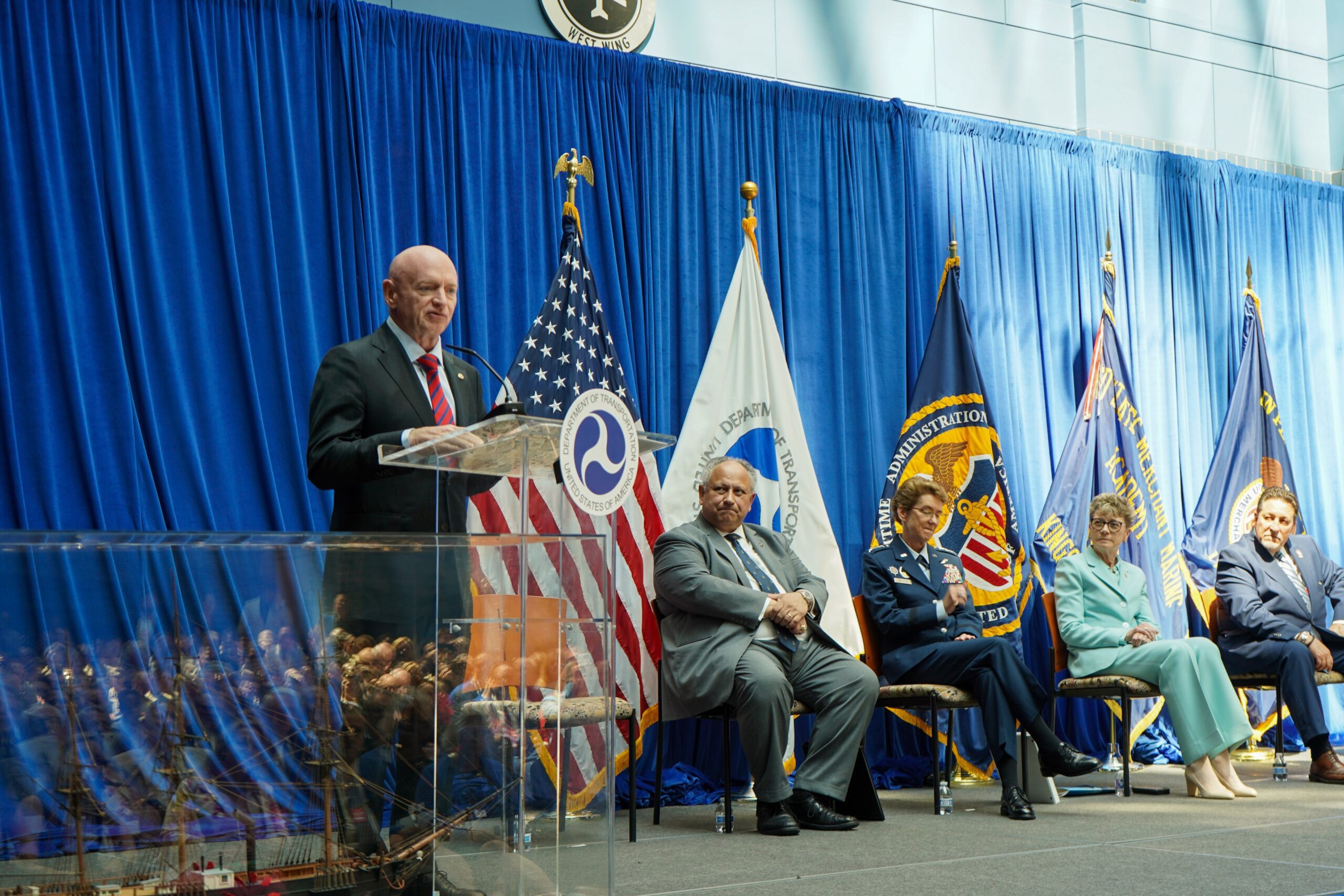 Senator Mark Kelly and the Secretary of the Navy Carlos Del Toro at MARAD headquarters for a speech about the US Merchant Marine