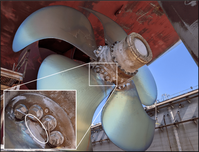 The 5-bladed controllable pitch propeller on the Maunalei showing a fracture (inset) at the base of the no. 4 blade. (Source: U.S. Coast Guard)
