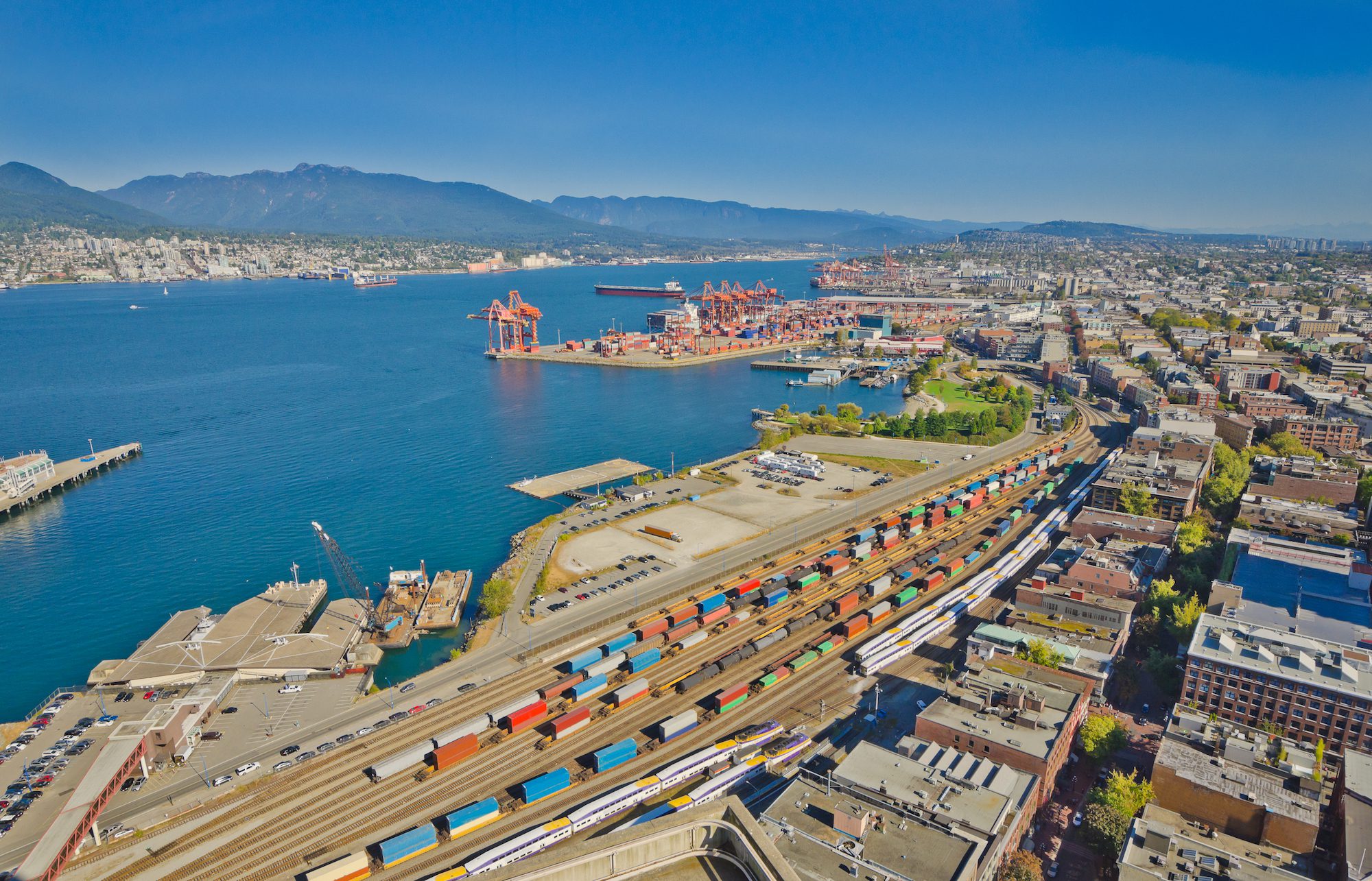 anoramic view city of Vancouver with the container port terminal and freight station with trains, oil-cars, tank-cars