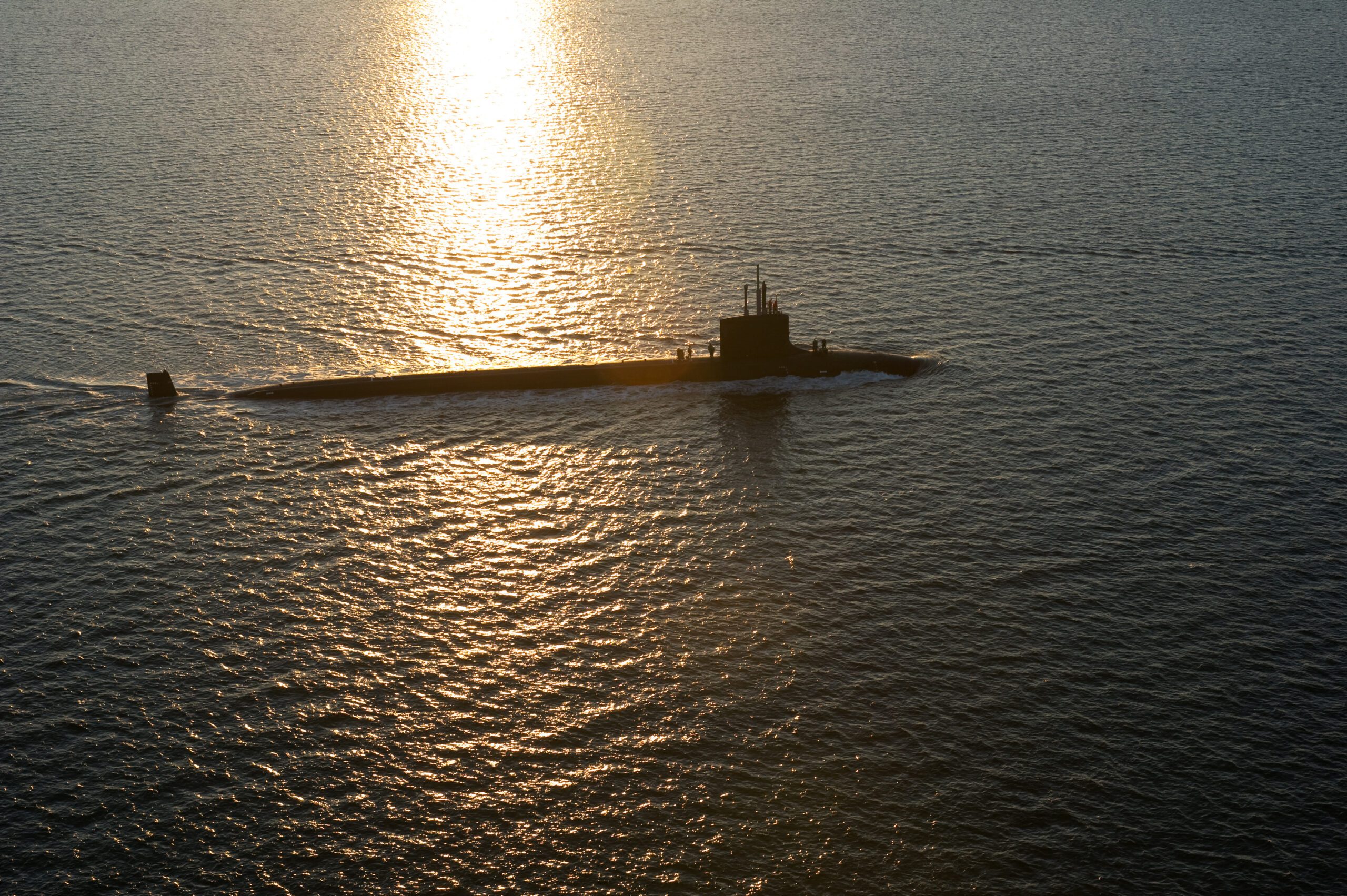 Sea Trials at sunset in the Atlantic ocean of a new Virginia class submarine