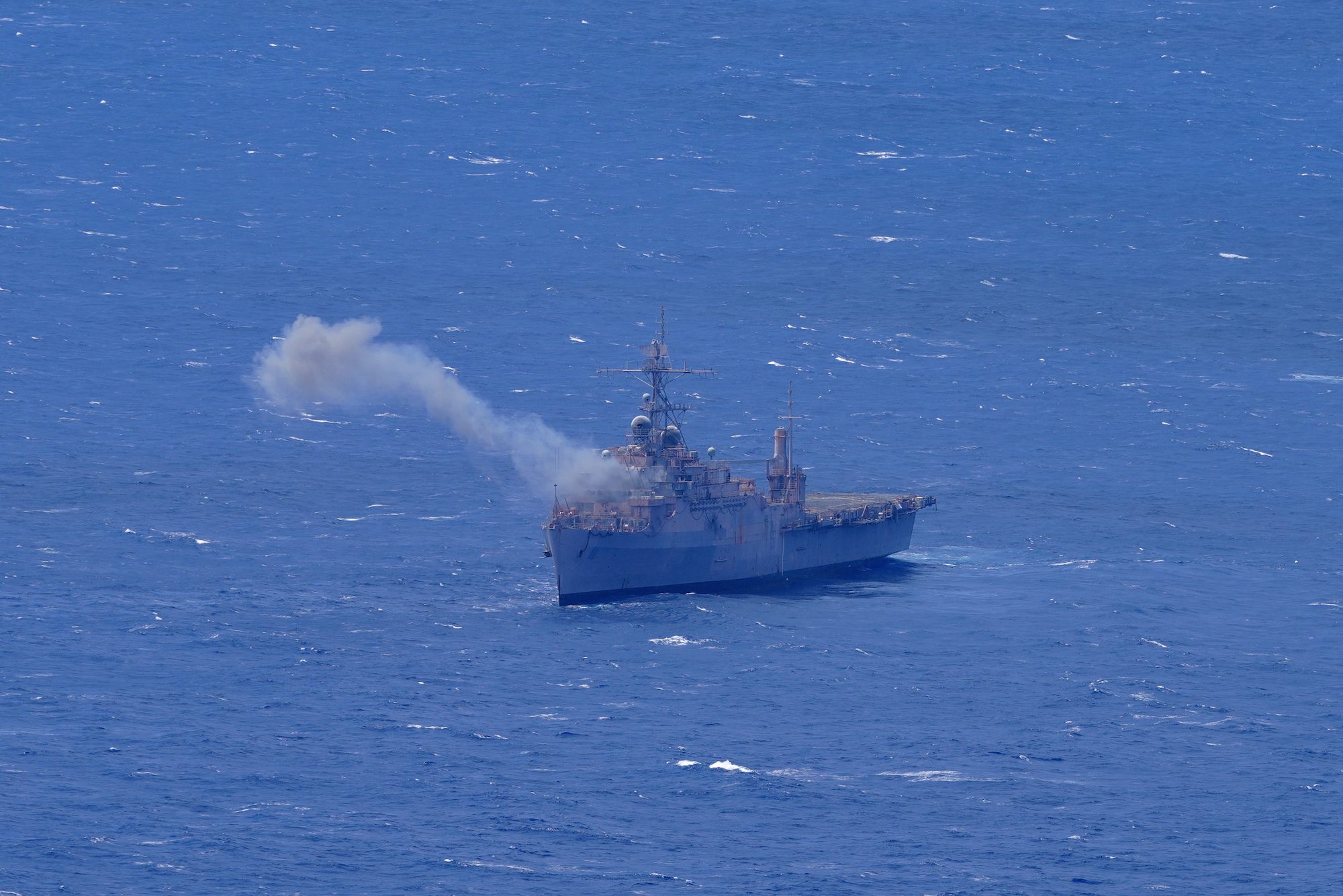 The decommissioned Austin-class amphibious transport dock USS Dubuque smokes after taking a direct hit with a missile during long-planned, live fire sinking exercise (SINKEX) during Exercise Rim of the Pacific (RIMPAC) 2024, July 11, 2024. U.S. Army photo by Sgt. Perla Alfaro