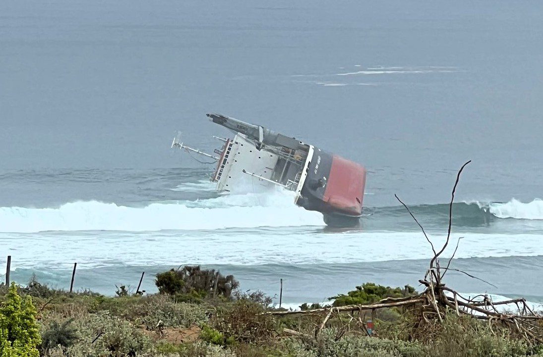 grounded Panama-flagged general cargo vessel, the Ultra Galaxy, on its side, showing the breach of its cargo holds. Photo courtesy SAMSA