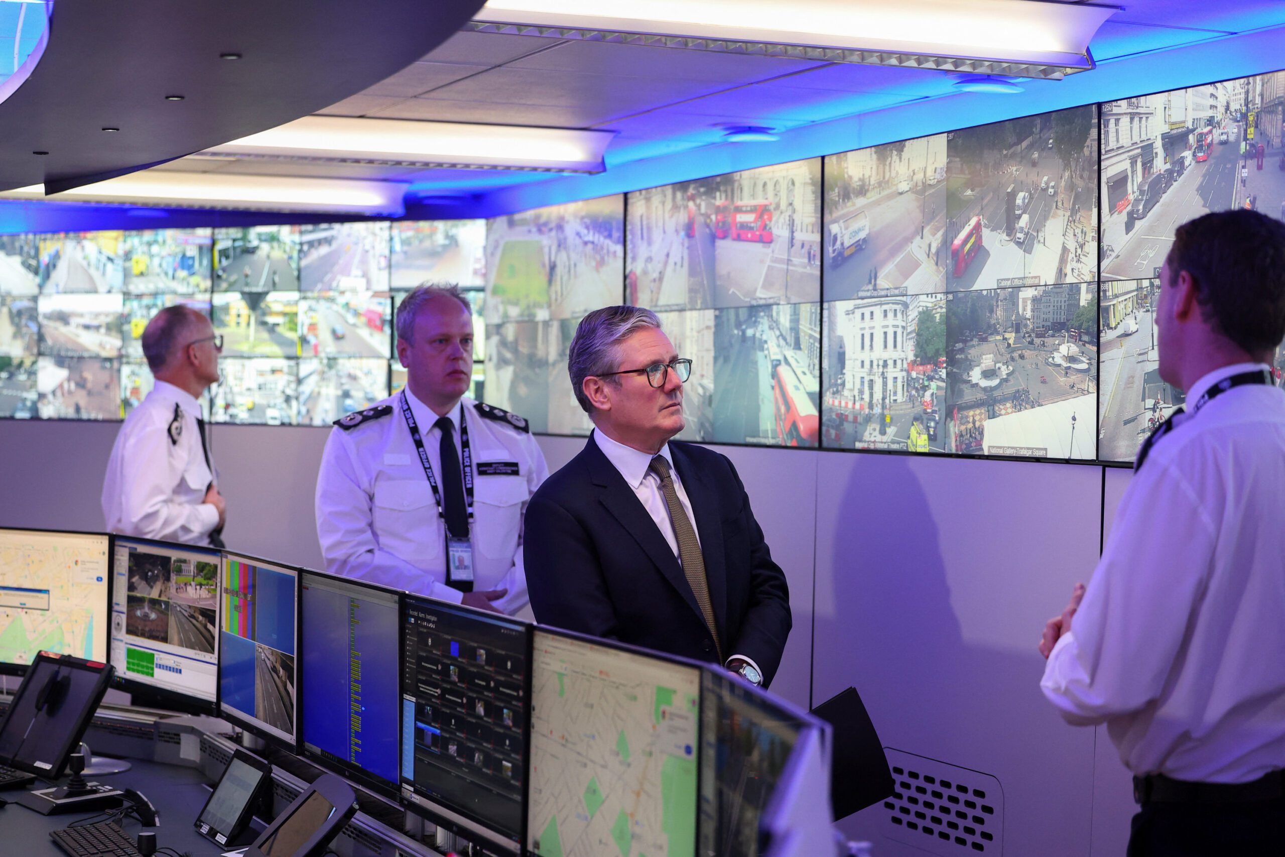 UK PM Keir Starmer views migrant data at police command center