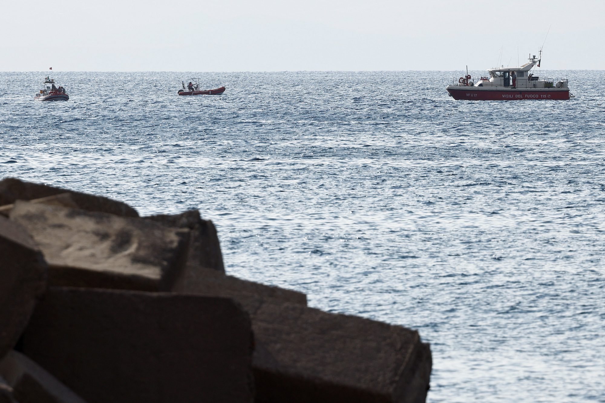 Rescue boats operate on the sea to search for the missing, including British entrepreneur Mike Lynch, after a luxury yacht sank off the coast of Porticello, near the Sicilian city of Palermo, Italy August 20, 2024. REUTERS/Guglielmo Mangiapane