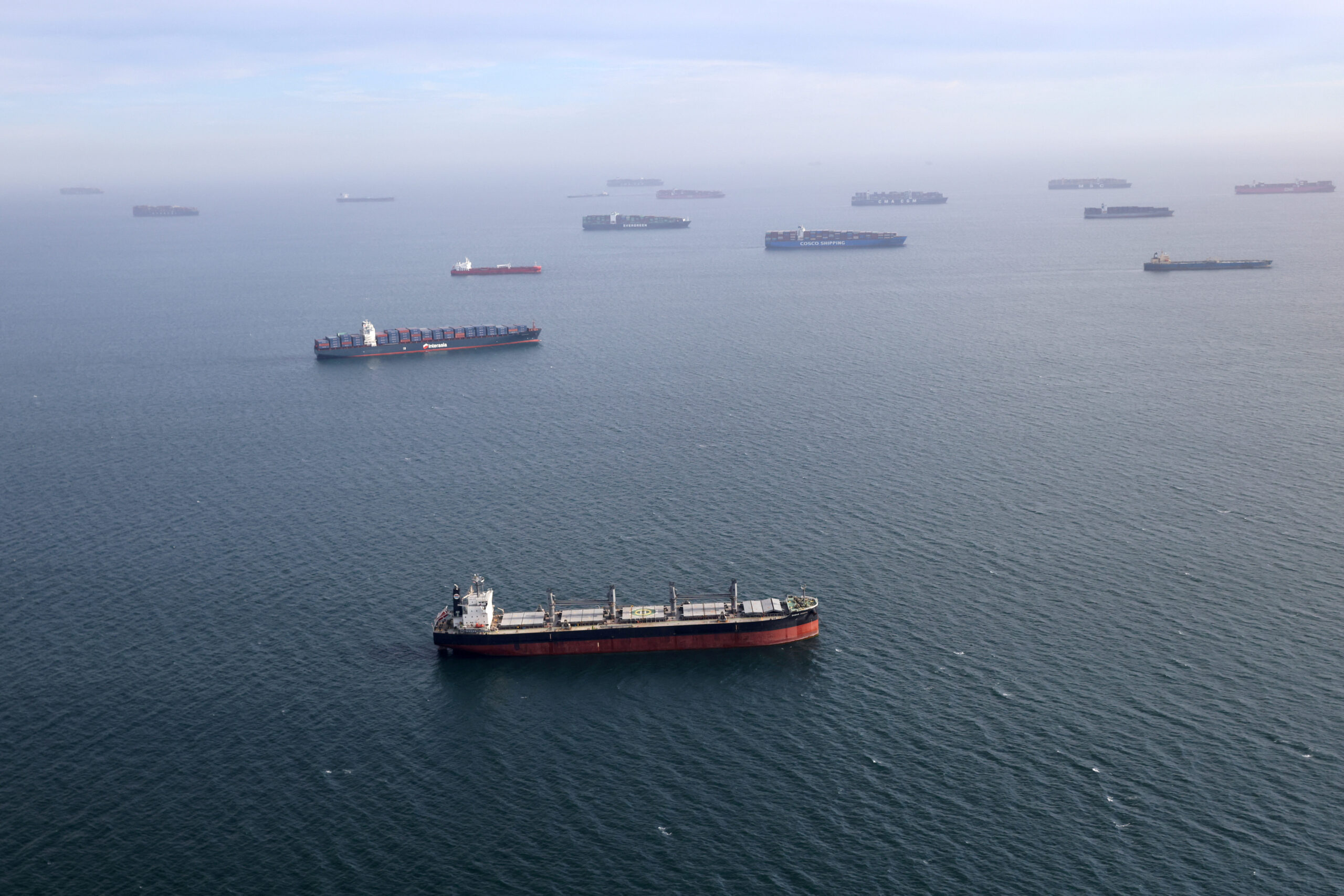 Container ships and oil tankers wait in the ocean outside the Port of Long Beach-Port of Los Angeles complex, amid the coronavirus disease (COVID-19) pandemic, in Los Angeles.REUTERS/Lucy Nicholson/File Photo