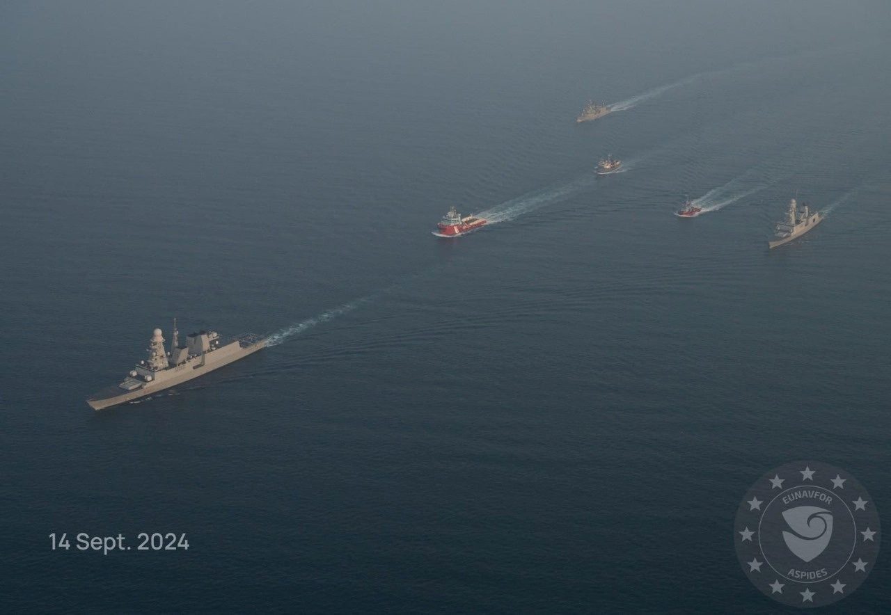 FILE PHOTO: Military vessels escort tugboats as they sail towards the damaged Greek-flagged oil tanker Sounion, which has been on fire since August 23, after an attack by Houthi militants, on the Red Sea, September 14, 2024 in this handout image. EUNAVFOR ASPIDES/Handout via REUTERS