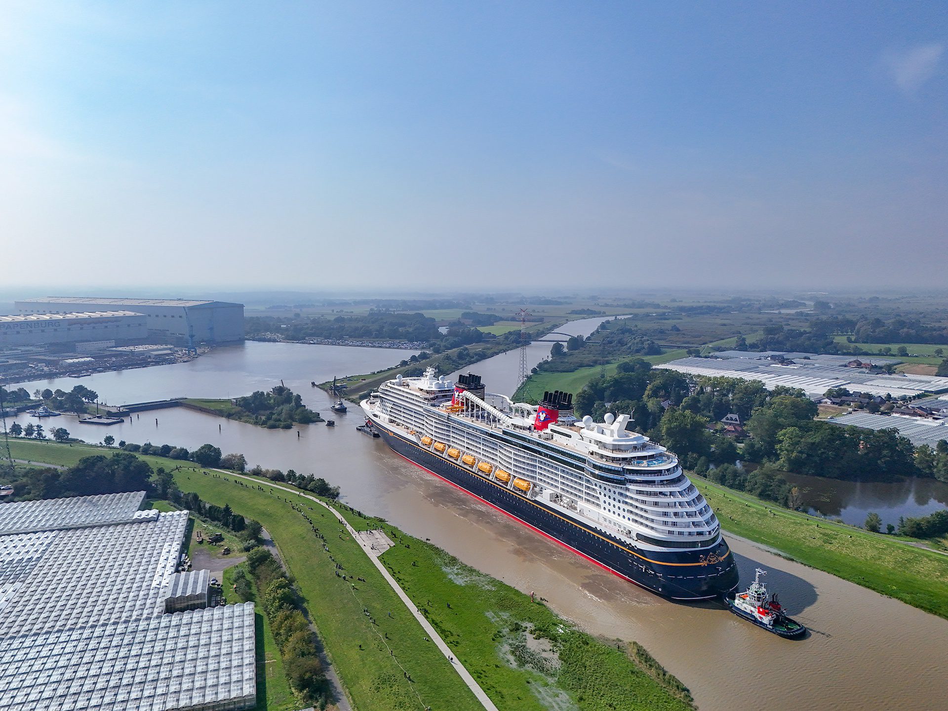 Disney Treasure departs Meyer Werft on its River Ems conveyance. Photo courtesy Meyer Werft