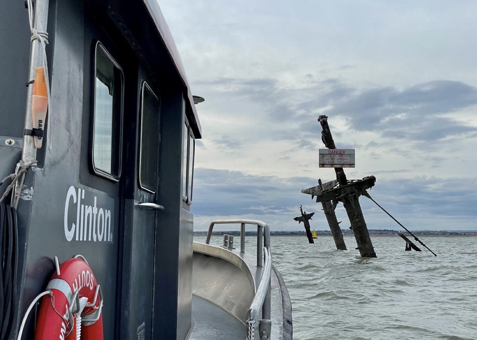 Photograph of M/V Lode and the SSRM’s three masts above the water