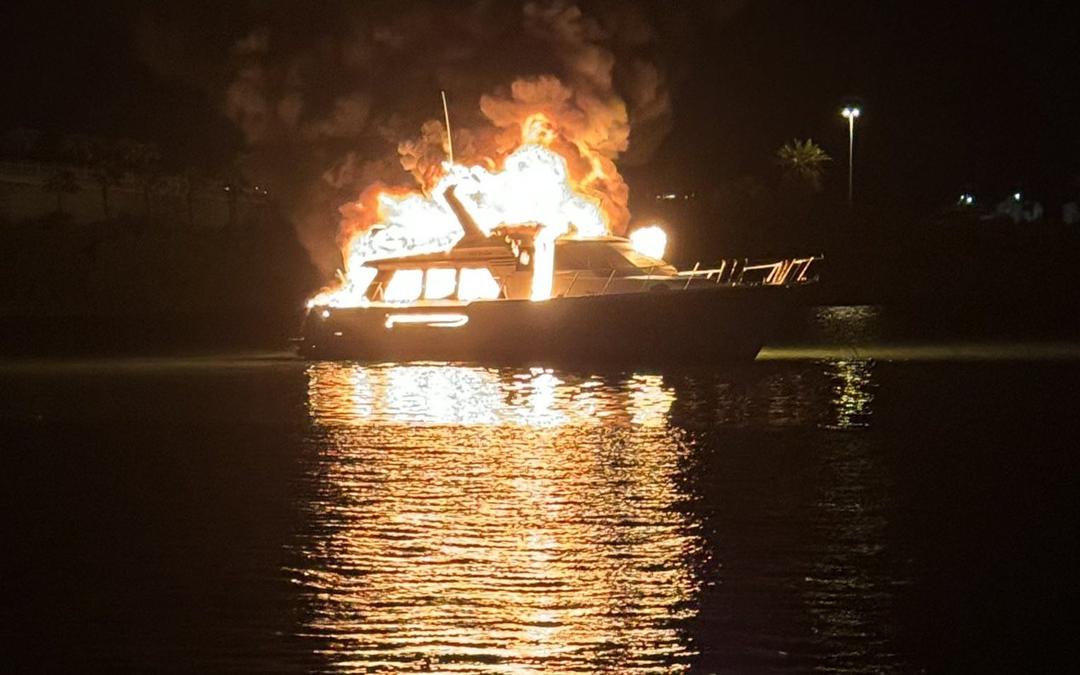 US Coast Guard photo of a large yacht engulfed in flames