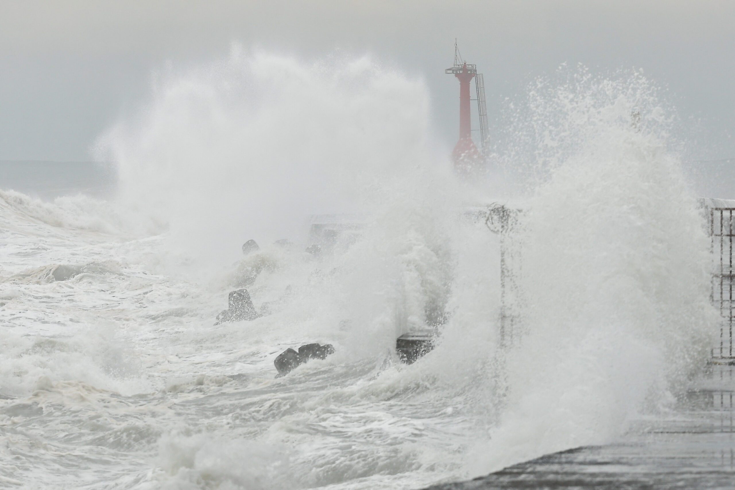 Photo of large typhoon waves smashing against a break-water in Taiwan