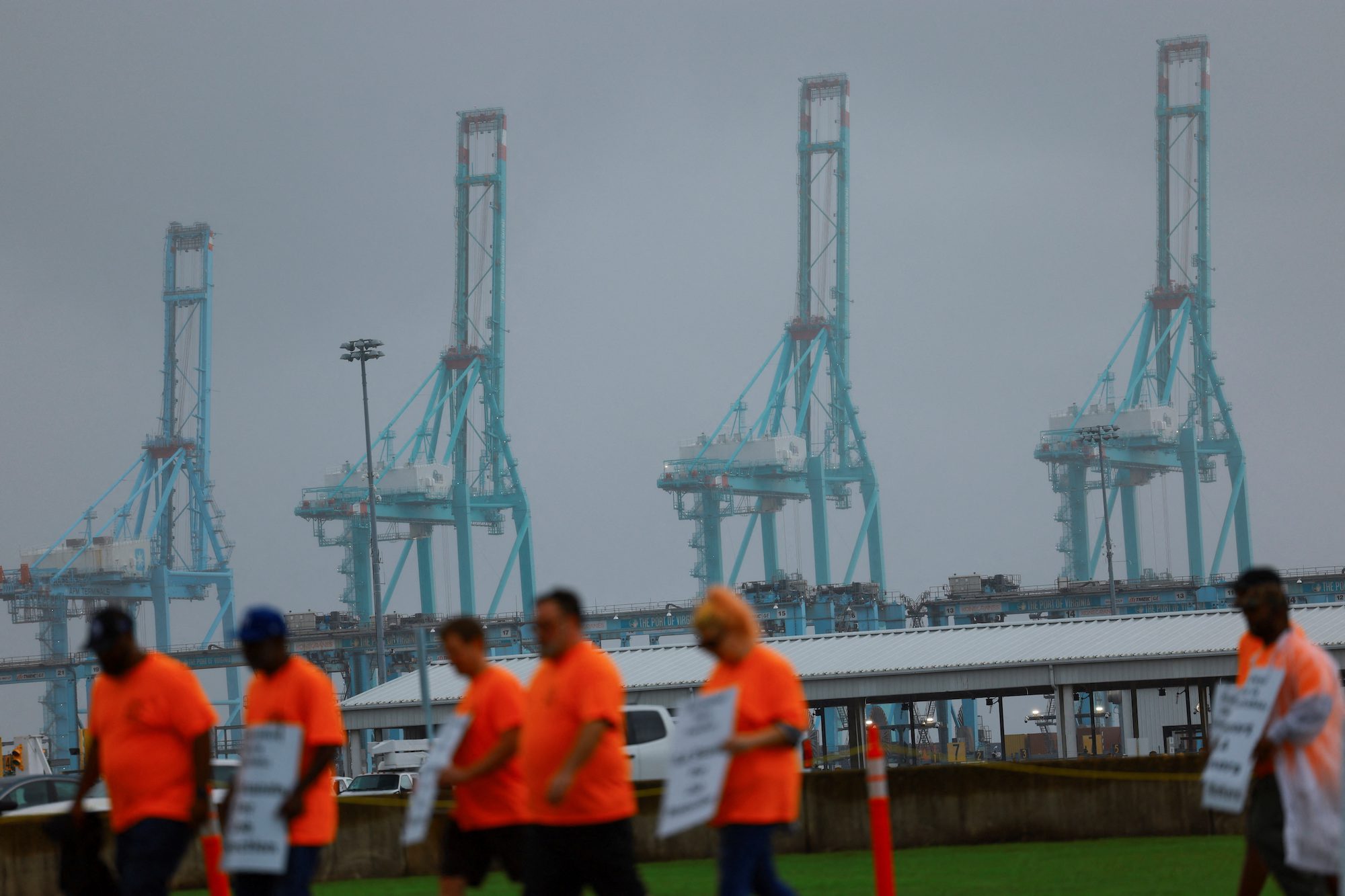 Port workers from the International Longshoremen's Association (ILA) participate in a strike in the Virginia International Gateway in Portsmouth, Virginia, U.S., October 1, 2024. REUTERS/Jose Luis Gonzalez