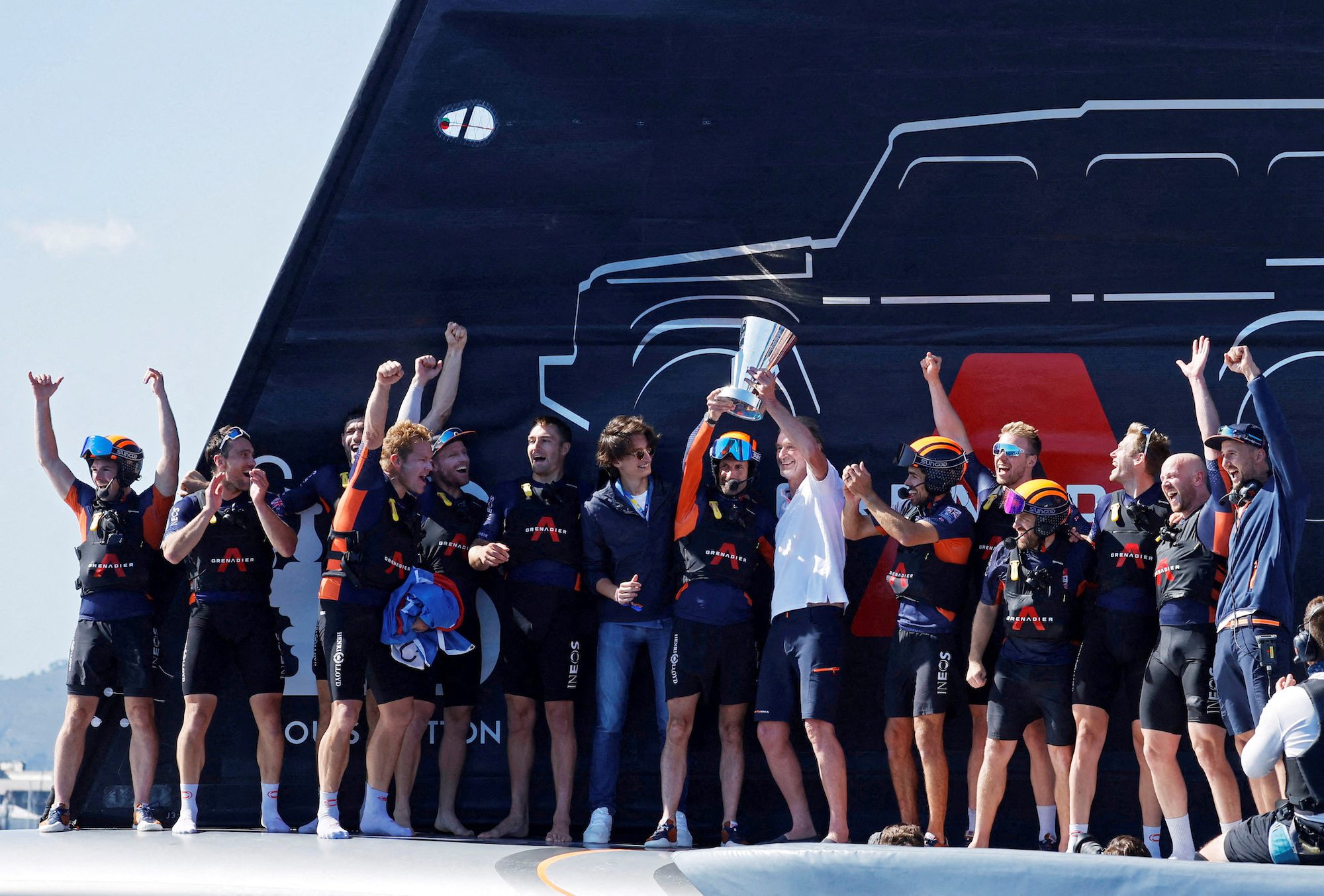 FILE PHOTO: October 4, 2024. Ineos Britannia's Ben Ainslie, crew members and Chairman and Chief Executive Officer of INEOS, Jim Ratcliffe celebrate with the trophy after winning round 11 and the final against Luna Rossa Prada Pirelli TeamRossa Prada Pirelli Team REUTERS/Albert Gea/File Photo