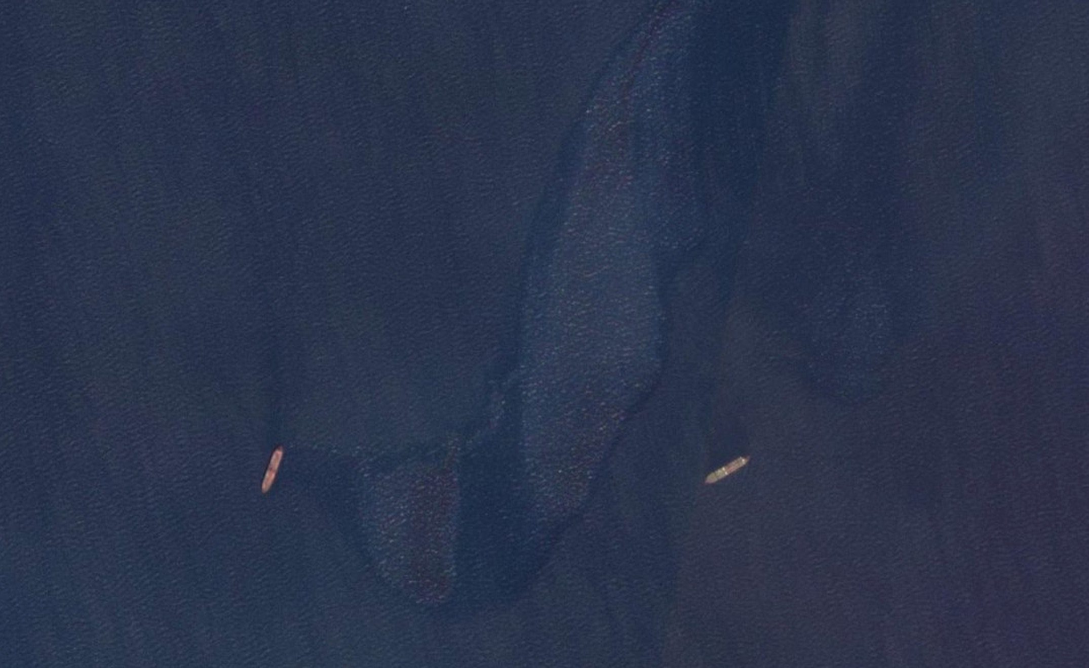 Shadow fleet oil tankers Fortune Galaxy and Serano II in the Persian Gulf on September 30, 2024 with a large oil spill visible